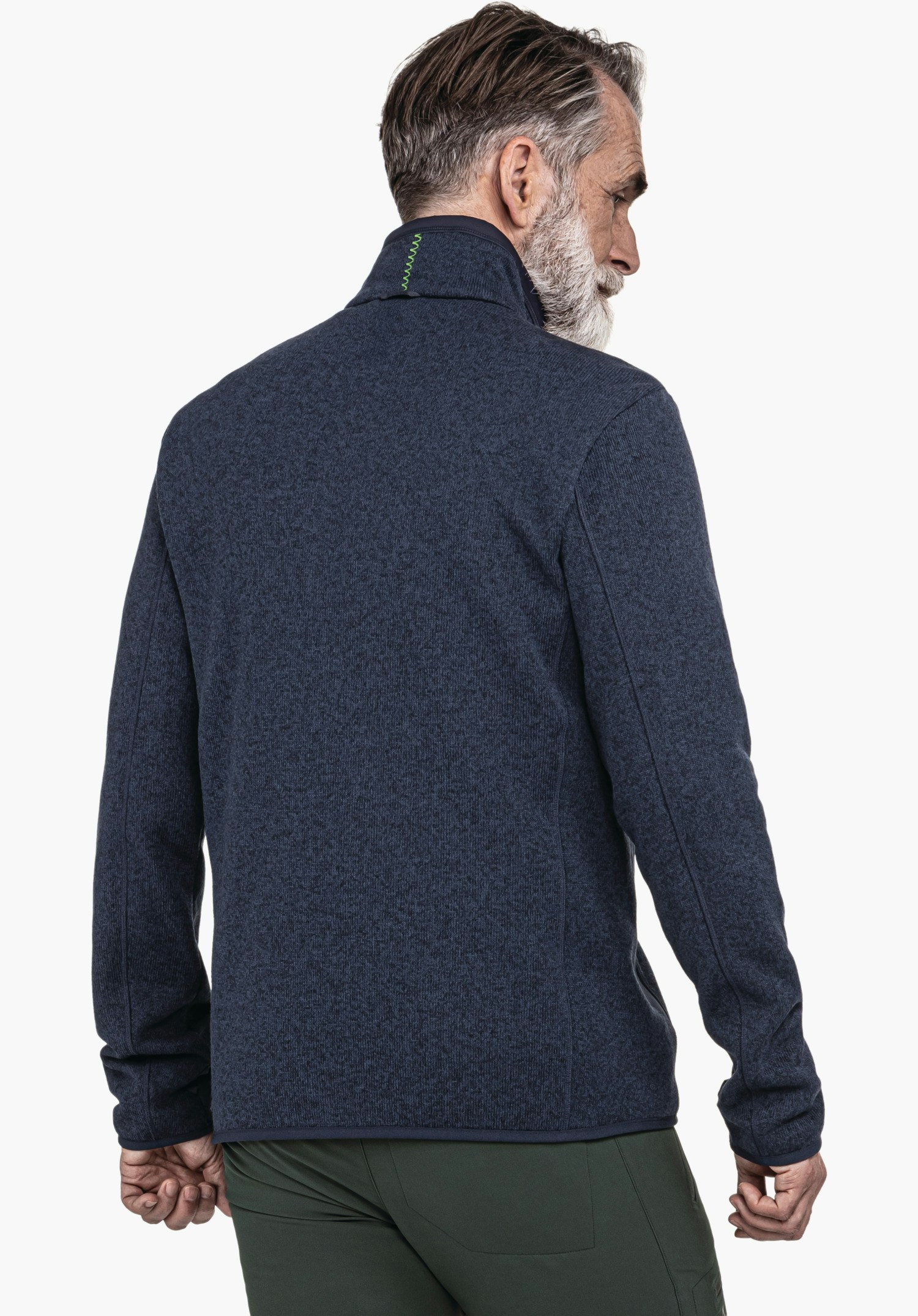 CIRC Fleece Jk Style Yew MNS dark blue jacket seen on the back of a standing man with head turned sideways; light white studio background; dark green trousers.