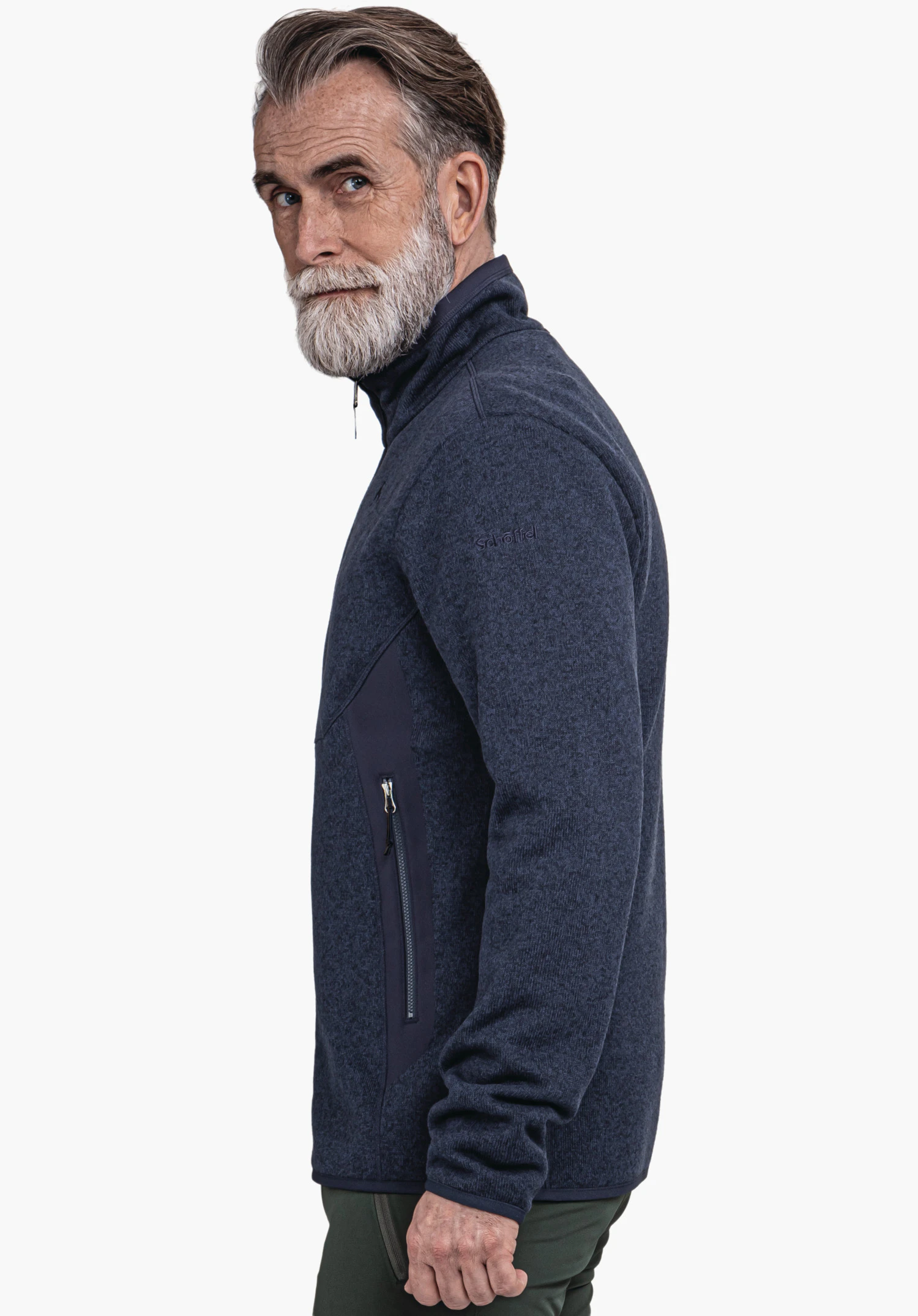 CIRC Fleece Jk Style Yew MNS dark blue jacket worn by a man looking side-on over the shoulder; standing in front of a white background. Text on sleeve: "schöffel".