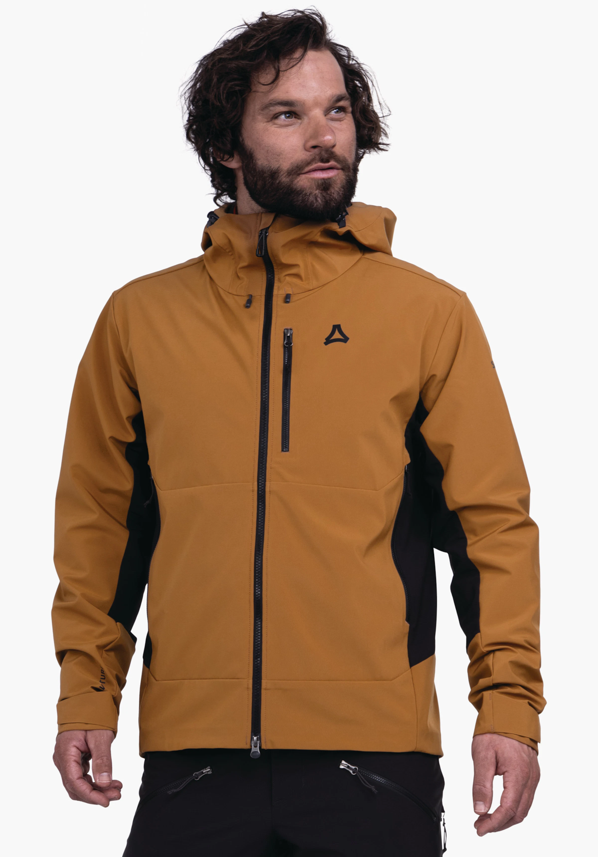 Softshell Jk Style Milagle MNS dunkel gelbe Softshell-Jacke mit Kapuze und schwarzem Seitenbesatz, sichtbarem Schöffel-Logo, wird von einem Mann getragen vor weißem Studiohintergrund.