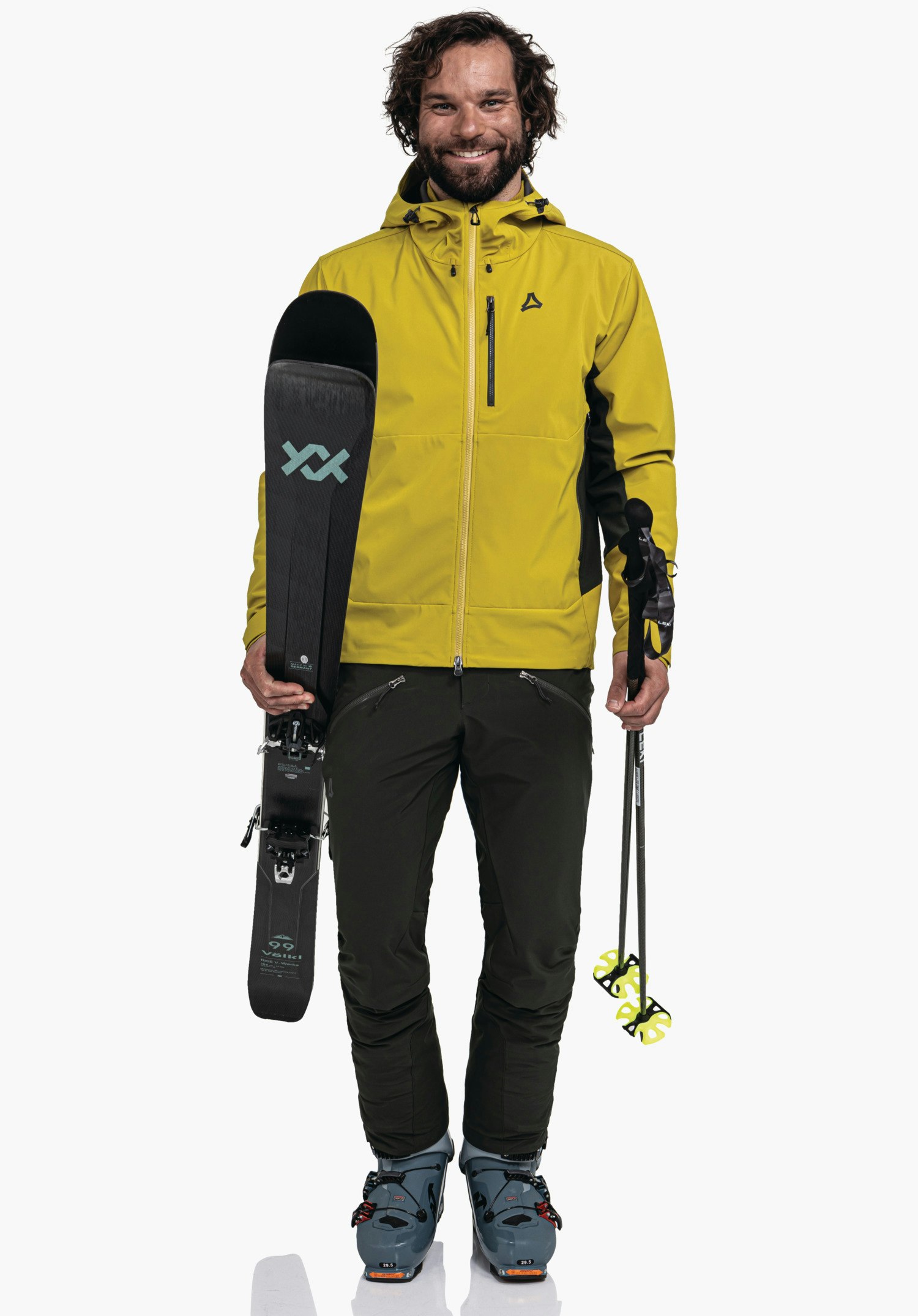 Softshell Jk Style Milagle MNS zeigt das Schöffel-Logo und den vertikalen Reißverschluss der Brusttasche auf dem gelben Material. Nahaufnahme vor weißem/neutralem Hintergrund.