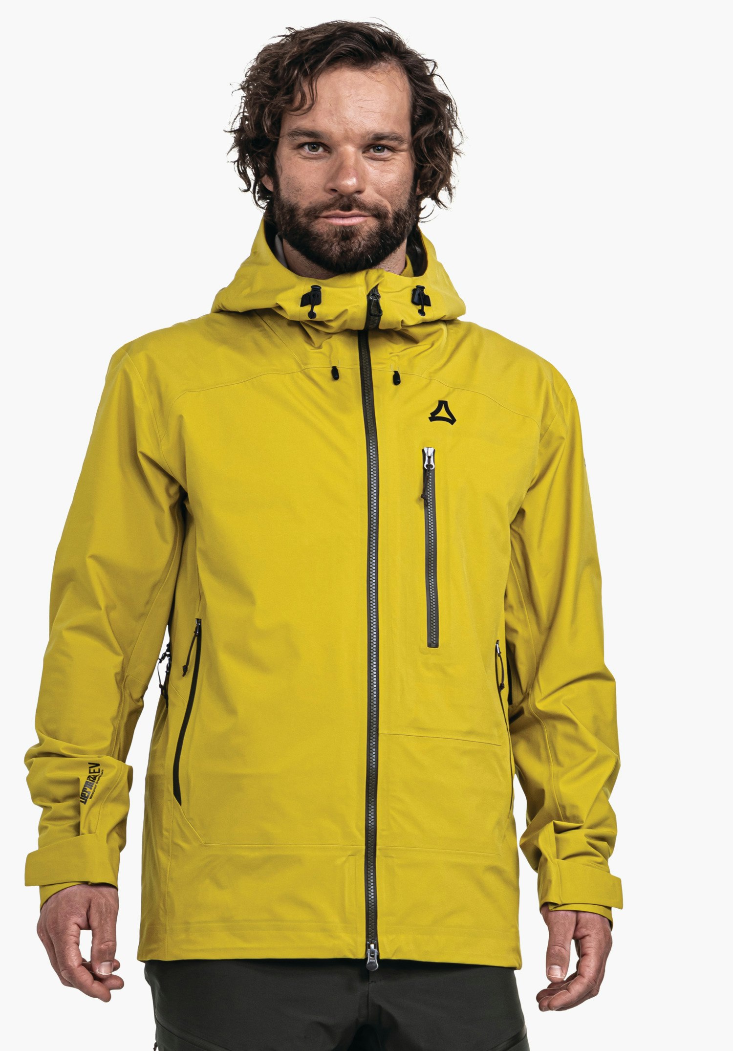 Jacket Style Milagle MNS Mann trägt hellgelbe Jacke mit Kapuze und schwarzen Reißverschlüssen, Schöffel-Logo auf der Brust; er steht frontal, Blick zur Kamera, neutraler weißer Hintergrund.