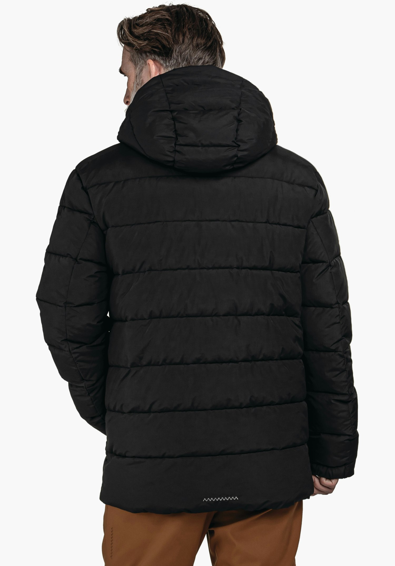 Ins Jacket Style Boslix MNS schwarze Steppjacke mit Kapuze, von einer stehenden Person von hinten getragen; weißer Hintergrund, braune Hose unten sichtbar.