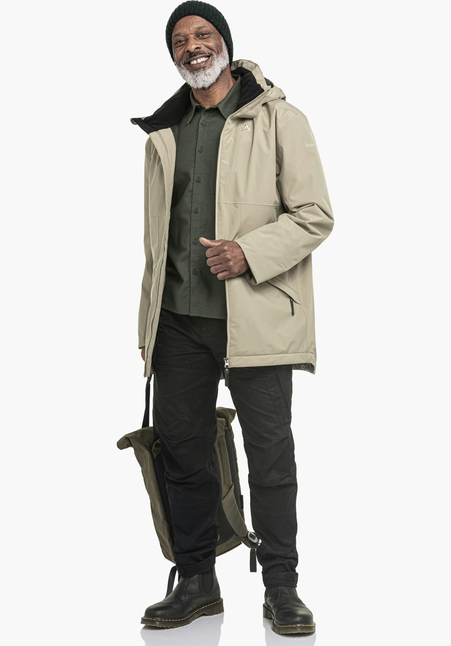 Ins Parka Style Malkay MNS zeigt das dezente Schöffel-Logo auf der braunen Brustpartie sowie den robusten Reißverschluss, Nahaufnahme vor weißem/neutralem Hintergrund.