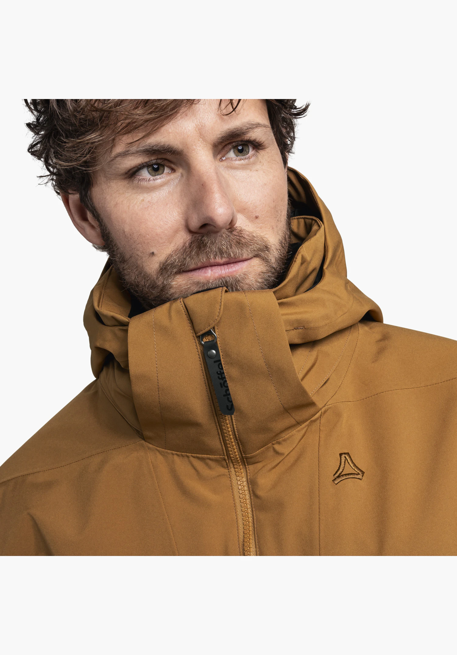 Ins Parka Style Malkay MNS in brown showing the high collar with zipper, a black Schöffel lettering on the puller and the embroidered Schöffel logo on the chest against a neutral background. Close-up against a neutral background.