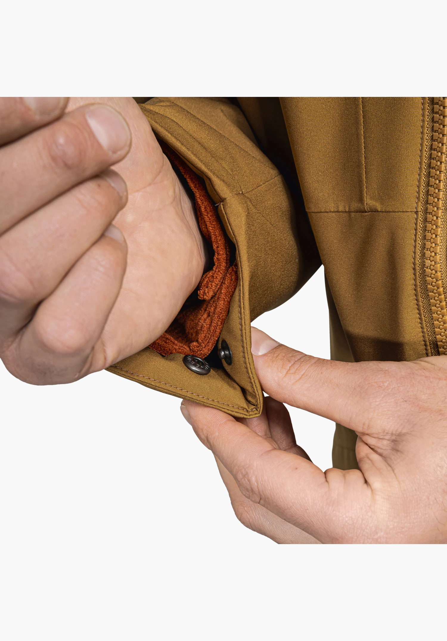 Ins Parka Style Malkay MNS brown sleeve cuff with adjustable snap fastener and integrated orange fleece inner cuff close-up against a white background.