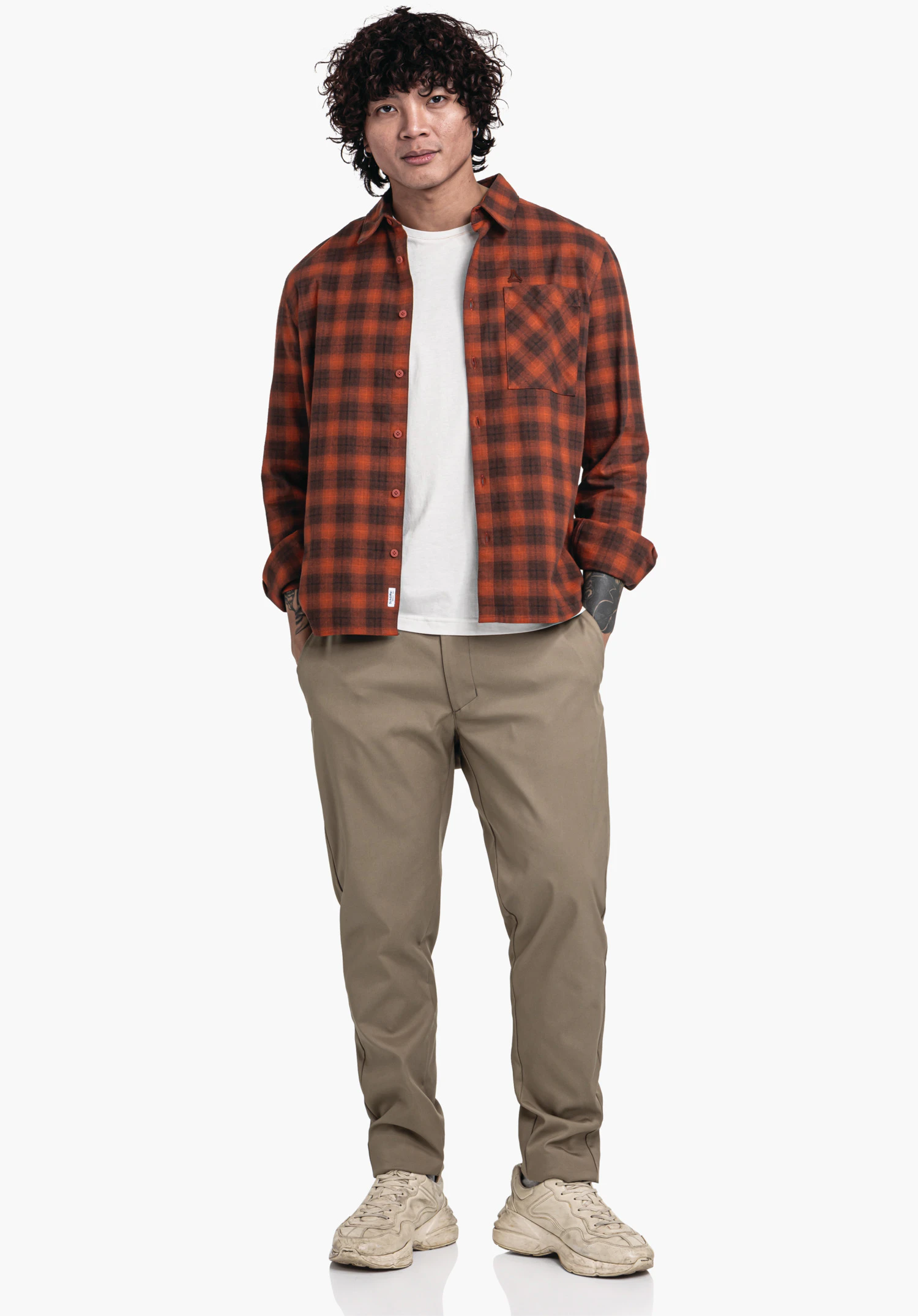 Shirt Style Kleion MNS shows the texture of the red checked flannel fabric, the patch chest pocket and the subtle Schöffel logo, close-up against a white/neutral background.