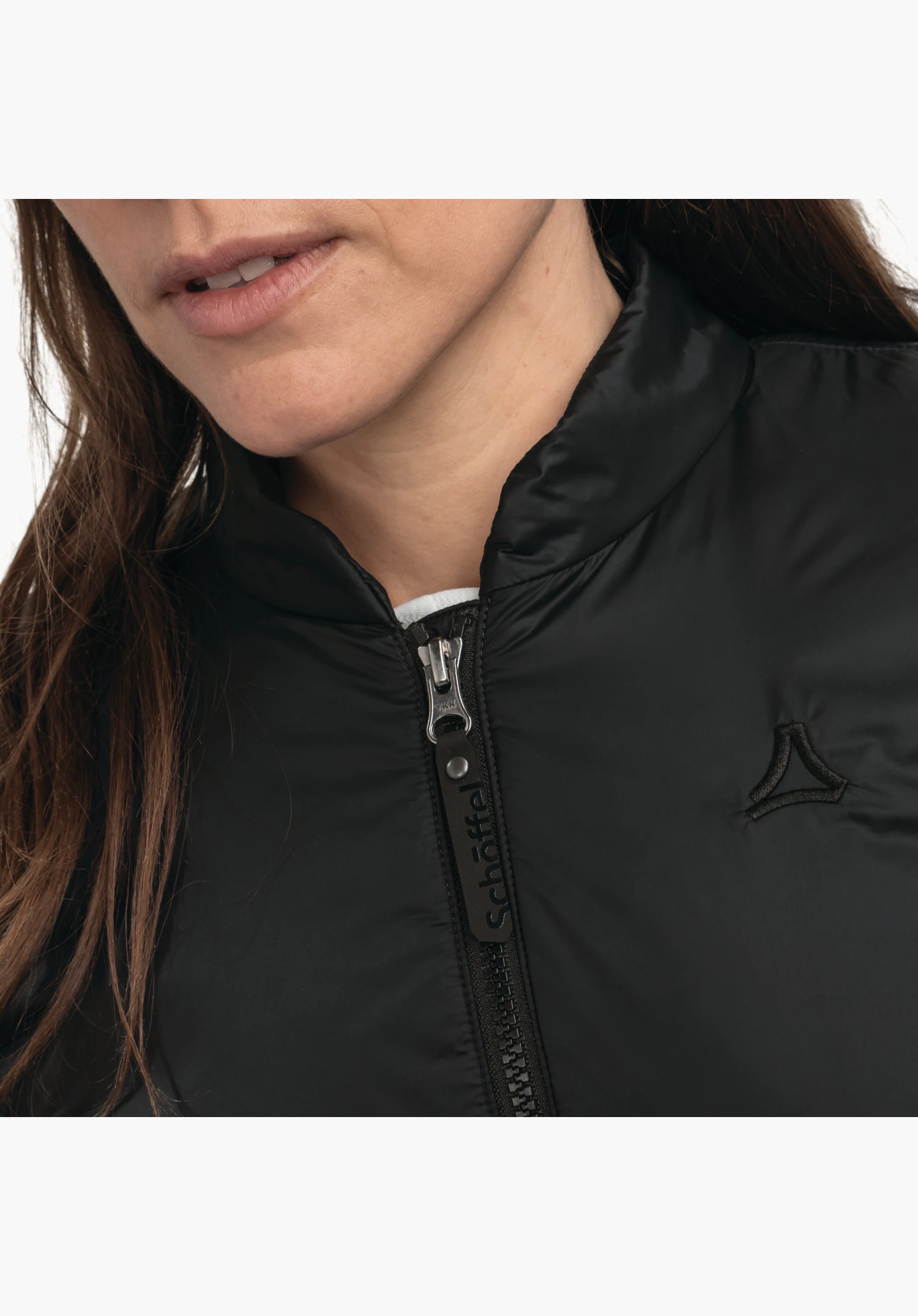 Ins Jacket Style Malkay WMS showing the black stand-up collar, the zip with distinctive Schöffel pull tab and the tonal logo on the chest in a close-up against a white background.