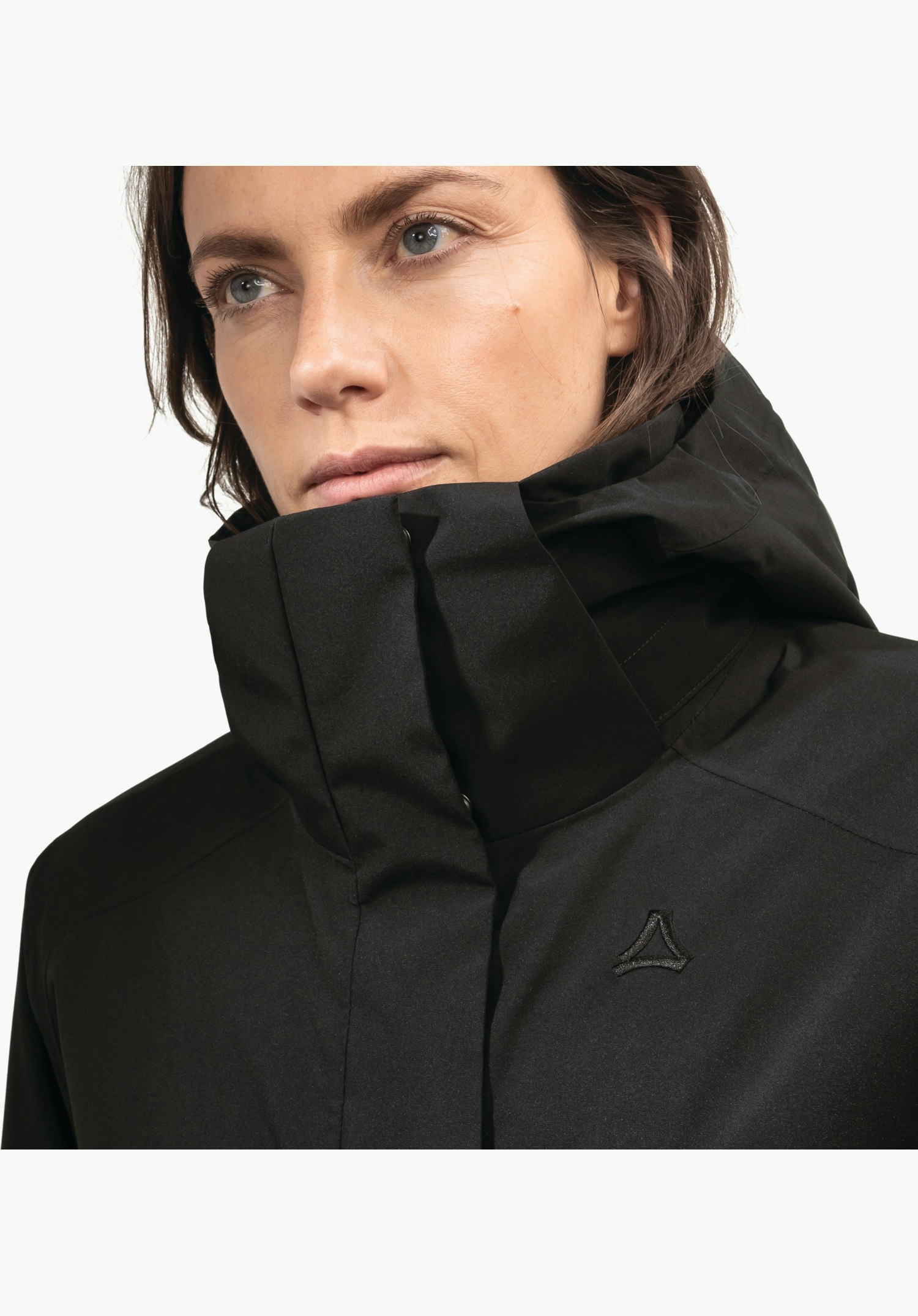 Ins Parka Style Malkay WMS montre le col haut et le logo Schöffel sur le tissu extérieur noir, gros plan sur fond neutre.