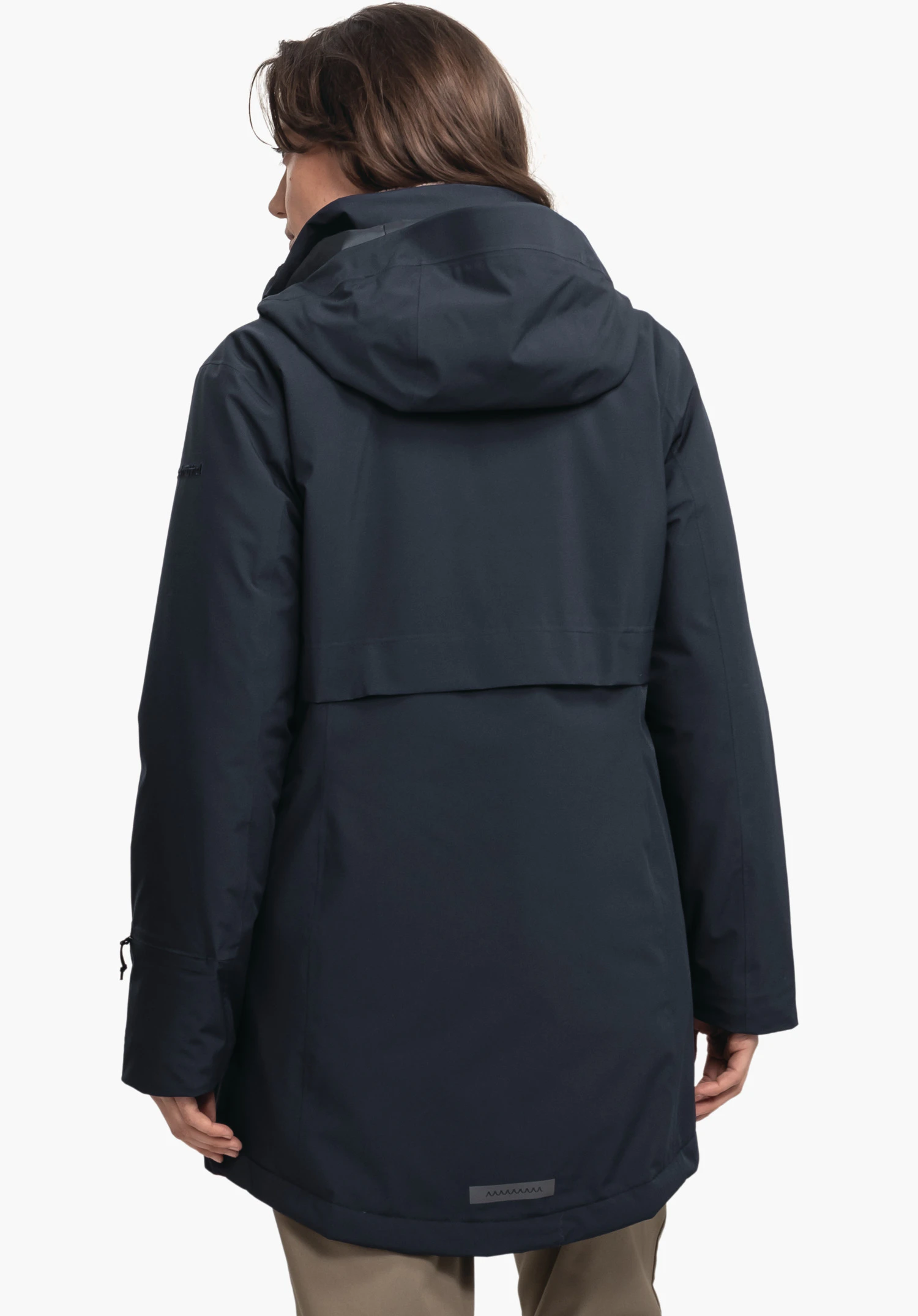 Ins Parka Style Malkay WMS dark blue parka worn by a person standing with back to the camera and head slightly turned left; hood up; white studio background.