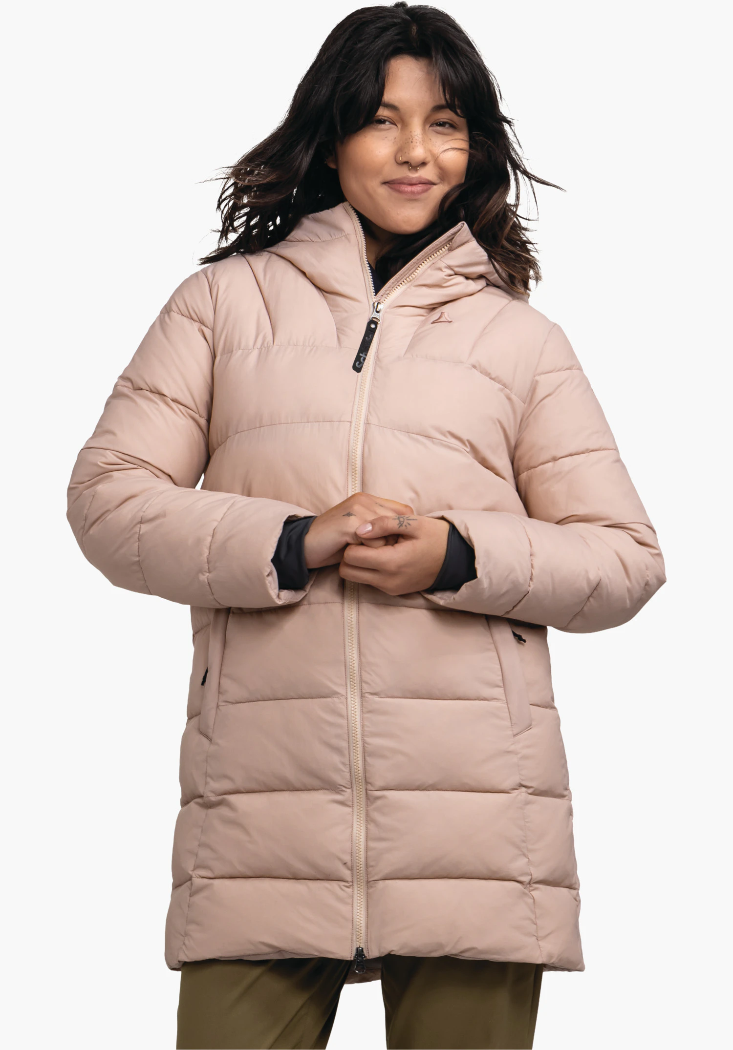 Ins Parka Style Boslix WMS light brown quilted coat with Schöffel logo, zipped up; worn by a smiling woman with dark brown hair, hands held in front; standing pose against a white background.