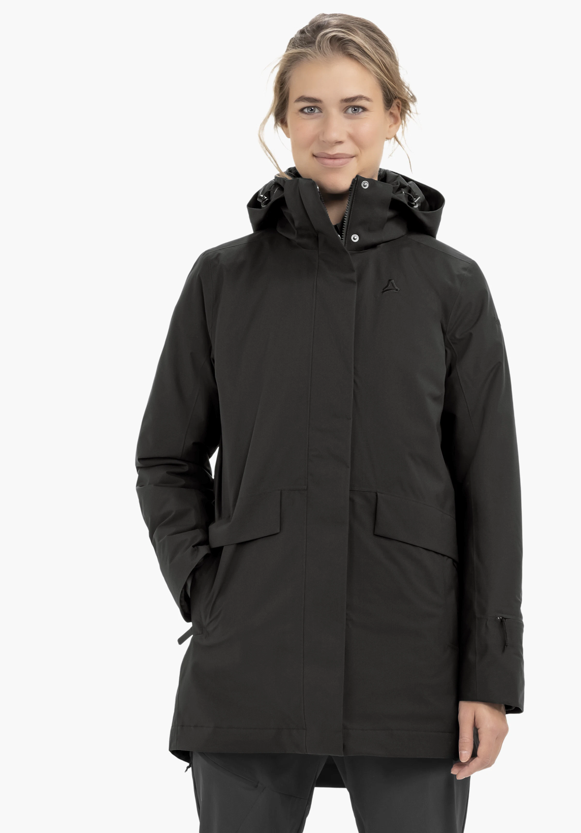 3in1 Parka Style Borkol WMS black parka with hood and Schöffel logo on the chest; worn standing by a person with one hand in pocket; neutral white background.