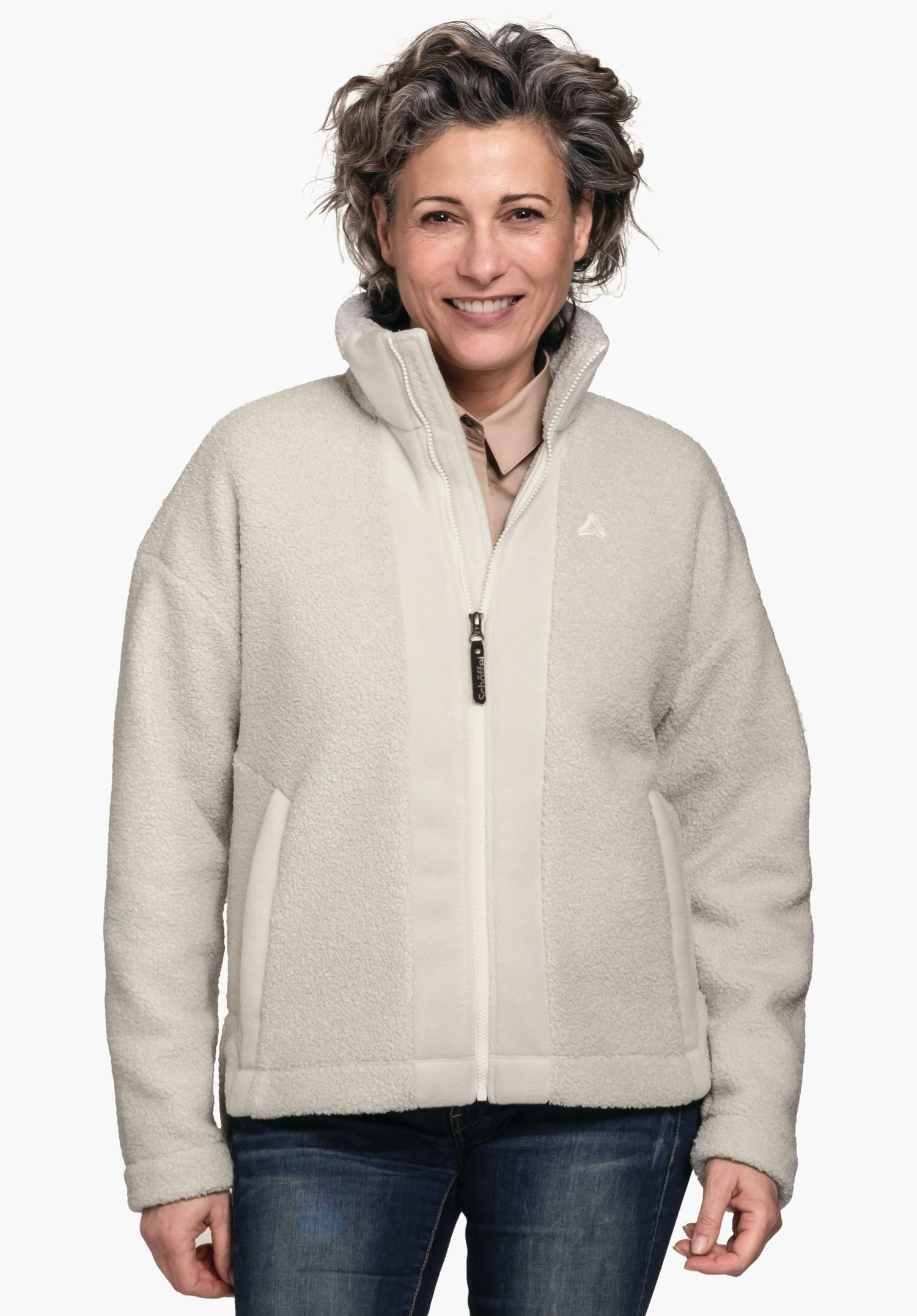 Fleece Jk Style Kalmor WMS jacket worn by a smiling person with zip pulled up; Schöffel logo on the chest; standing against a light neutral background.