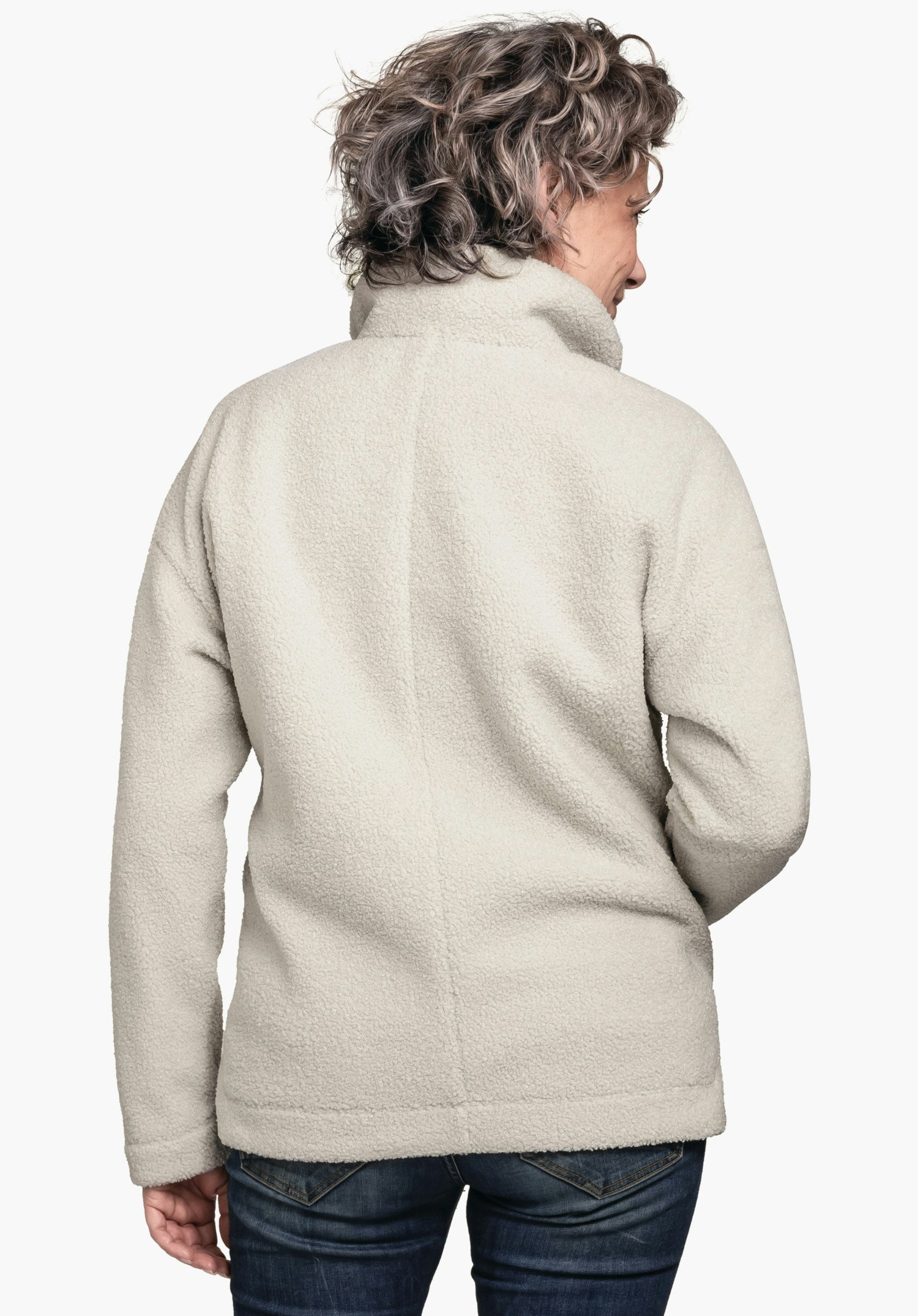 Fleece Jk Style Kalmor WMS off-white fleece jacket worn by a person standing with back to the camera, slightly turned right; high collar; neutral white background, dark blue jeans worn.