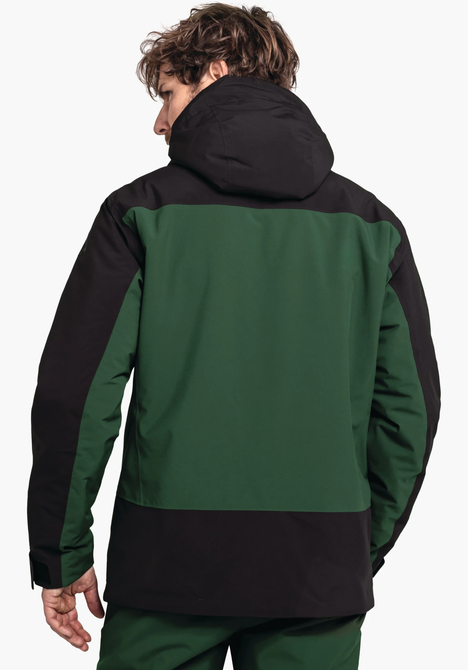 Jacket Style Zandwel MNS dark green and black jacket, rear view; man wears it with head slightly turned sideways; neutral white background.