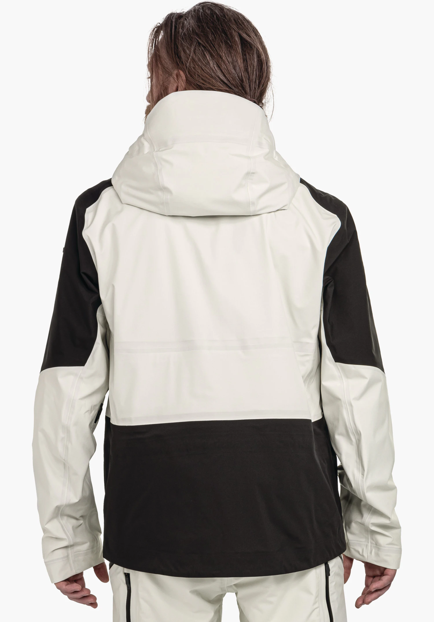 Shell Jk Style Lufeld MNS jacket (rear view); person wears an off-white jacket with black inserts; hood up, arms relaxed at the sides; neutral light background.