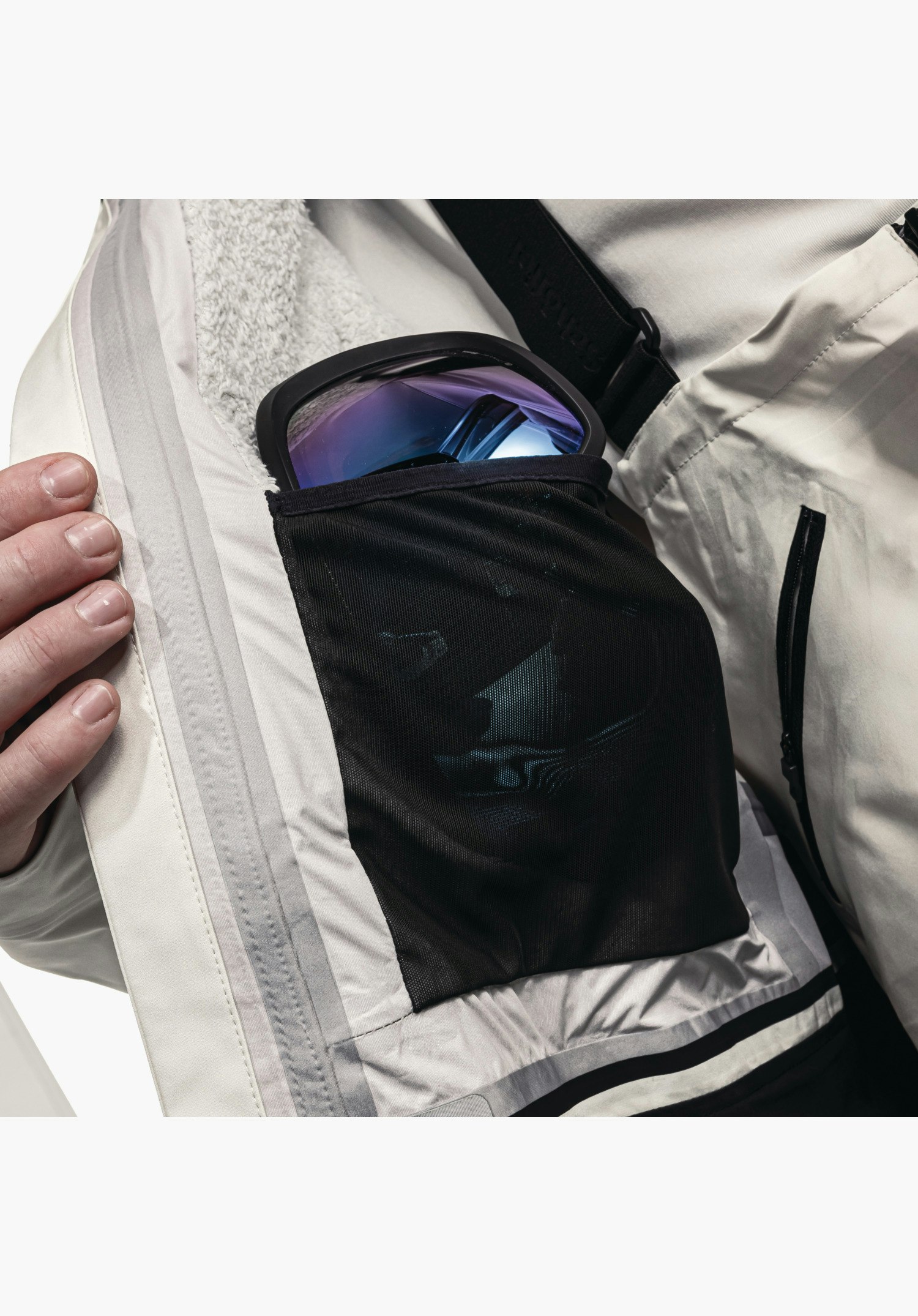 Shell Jk Style Lufeld MNS interior in natur featuring a black mesh pocket for ski goggles, Schöffel lettering on the brace and soft lining, close-up shot against a white/neutral background.