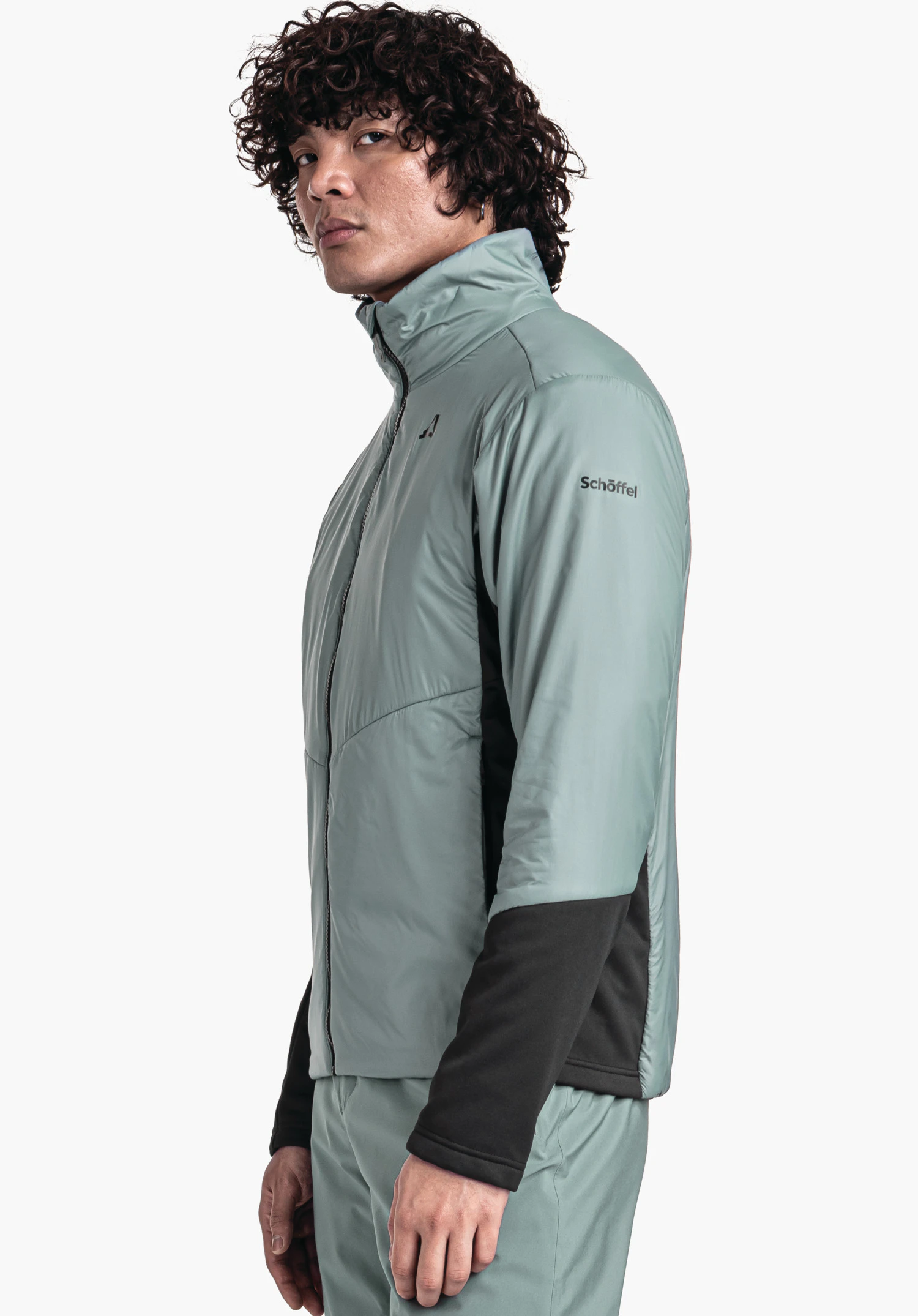 Ins Jacket Style Pontre MNS light green jacket, worn by a person standing sideways; black sleeve and side inserts; Schöffel logo on the chest; lettering "Schöffel" on the upper arm; white background.