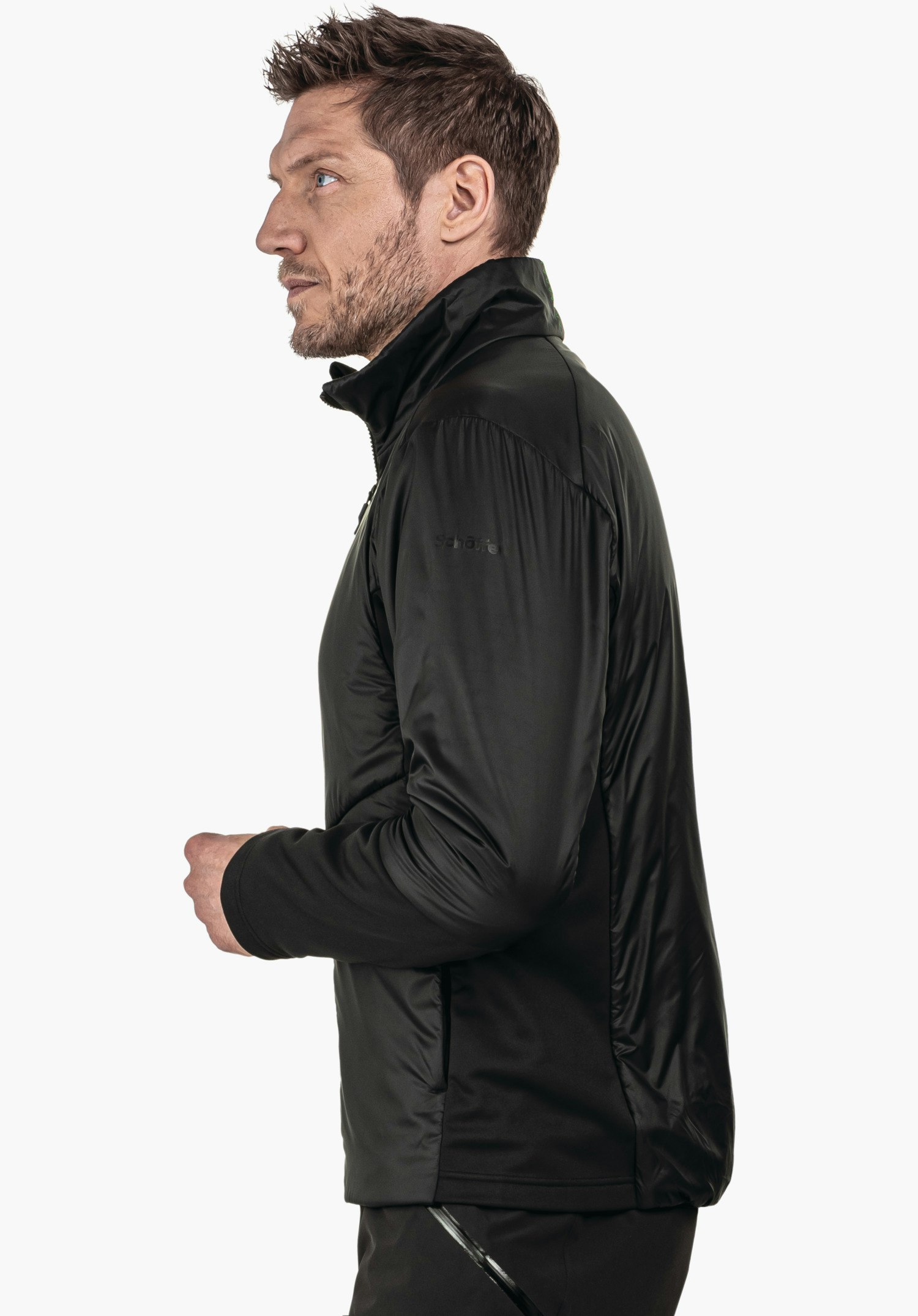 Ins Jacket Style Pontre MNS man wearing a black jacket, standing sideways and looking forward with hands held in front of the body; bright white studio setting. Sleeve text: "schöffel".
