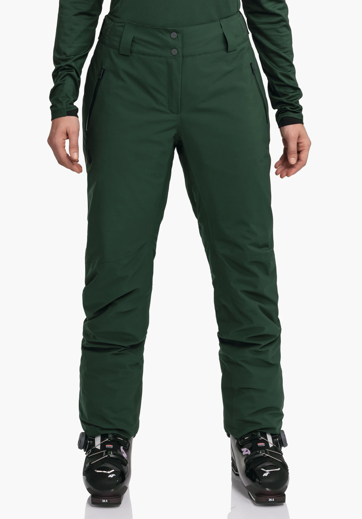Pants Style Pine WMS dark green ski trousers worn standing straight; arms at sides; black ski boots with “26.5” print; white background.