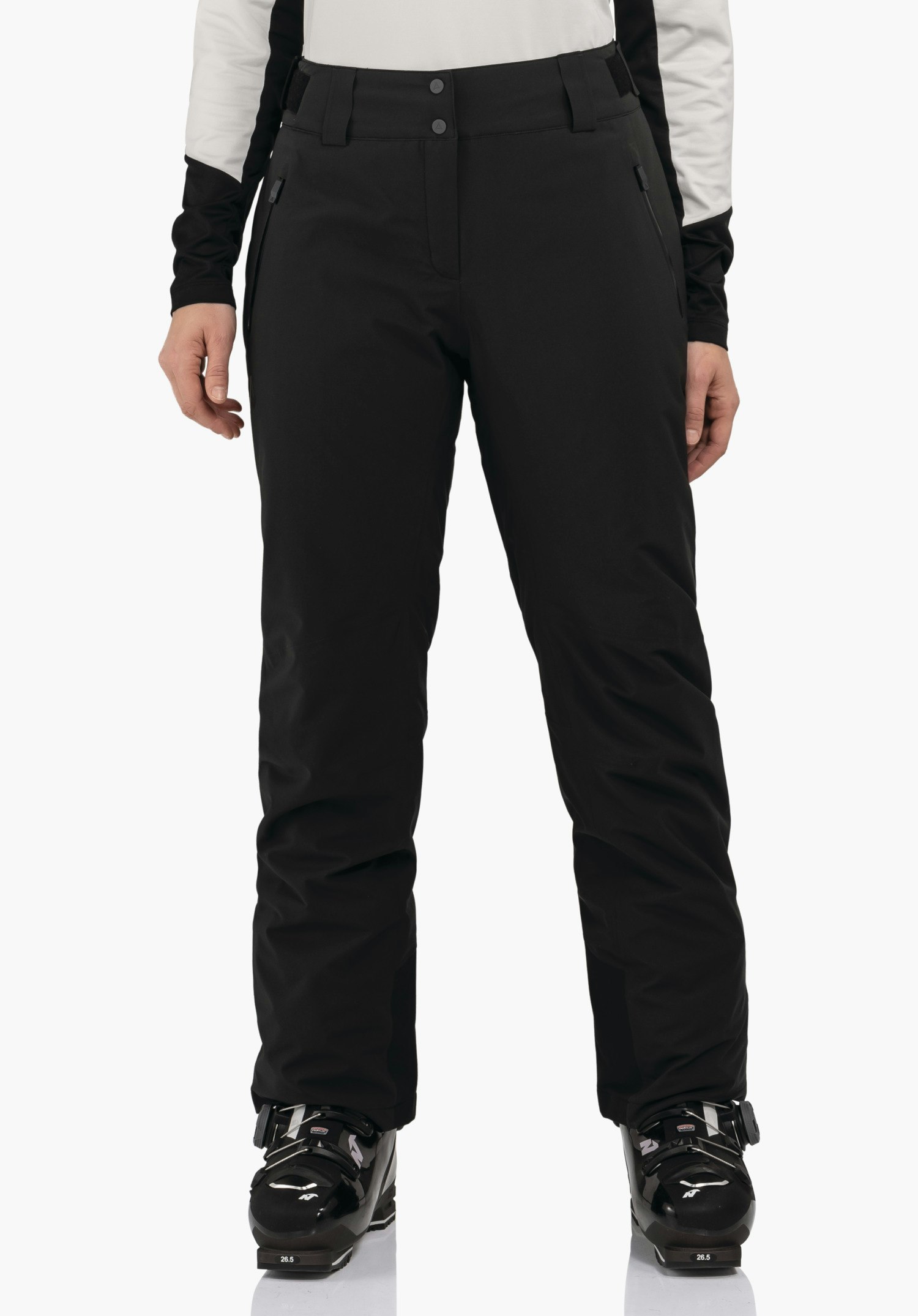 Pants Style Pine WMS black ski trousers worn by a standing model, photographed front-facing; white sleeves visible and black ski boots with “26.5” text; white background.