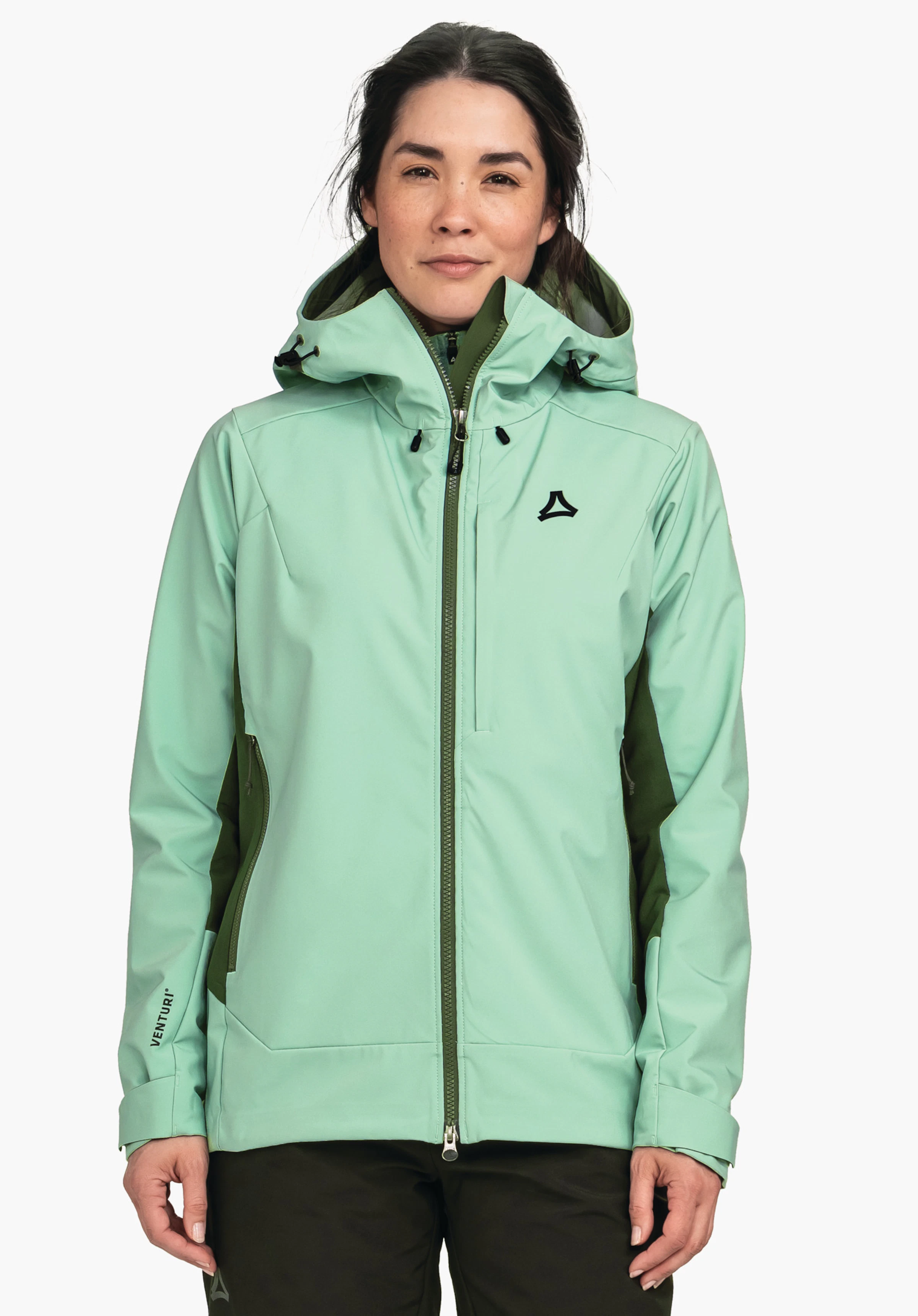 Softshell Jk Style Milagle WMS lichtblauwe outdoorjack wordt gedragen met capuchon en zwarte zij-inzetstukken, model staat frontaal voor een witte achtergrond; Schöffel-logo zichtbaar. Tekst: "VENTURI", "SCHÖFFEL".