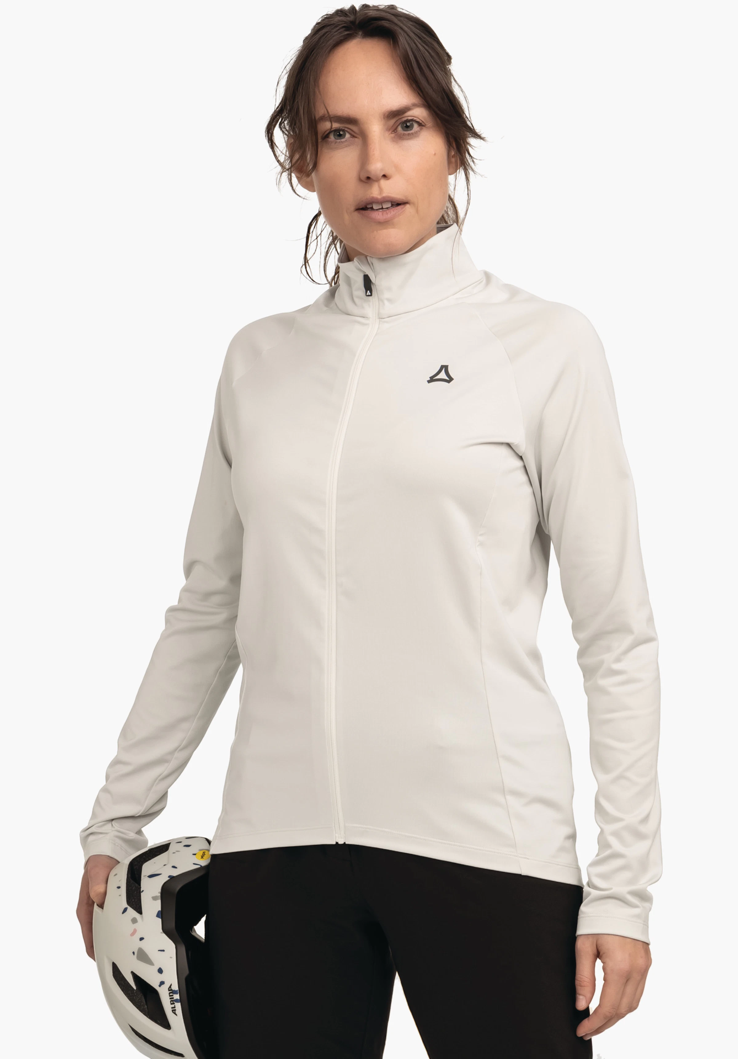 Longsleeve Style Kubena WMS off-white sports jacket with zip closed and Schöffel logo on the chest; worn by a woman holding a white speckled helmet; light neutral background.