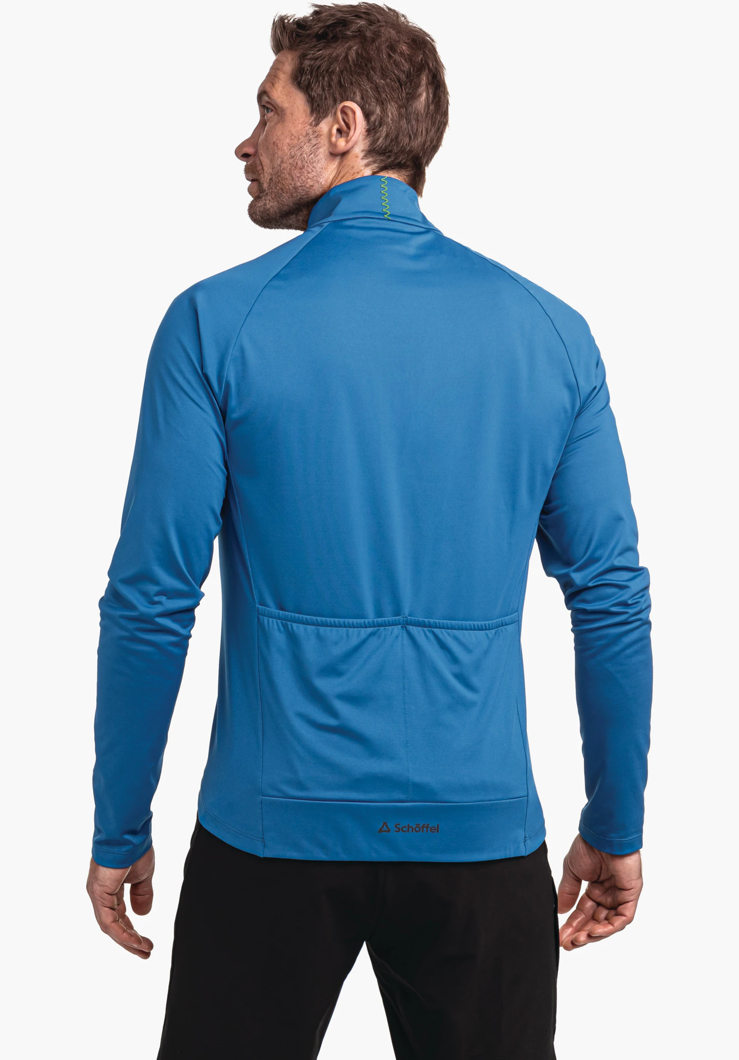 Longsleeve Style Kubena MNS blue long-sleeve performance jacket worn by a man, rear view; jacket lies flat with three pockets at the lower back; white background. Text: “Schöffel” and Schöffel logo.