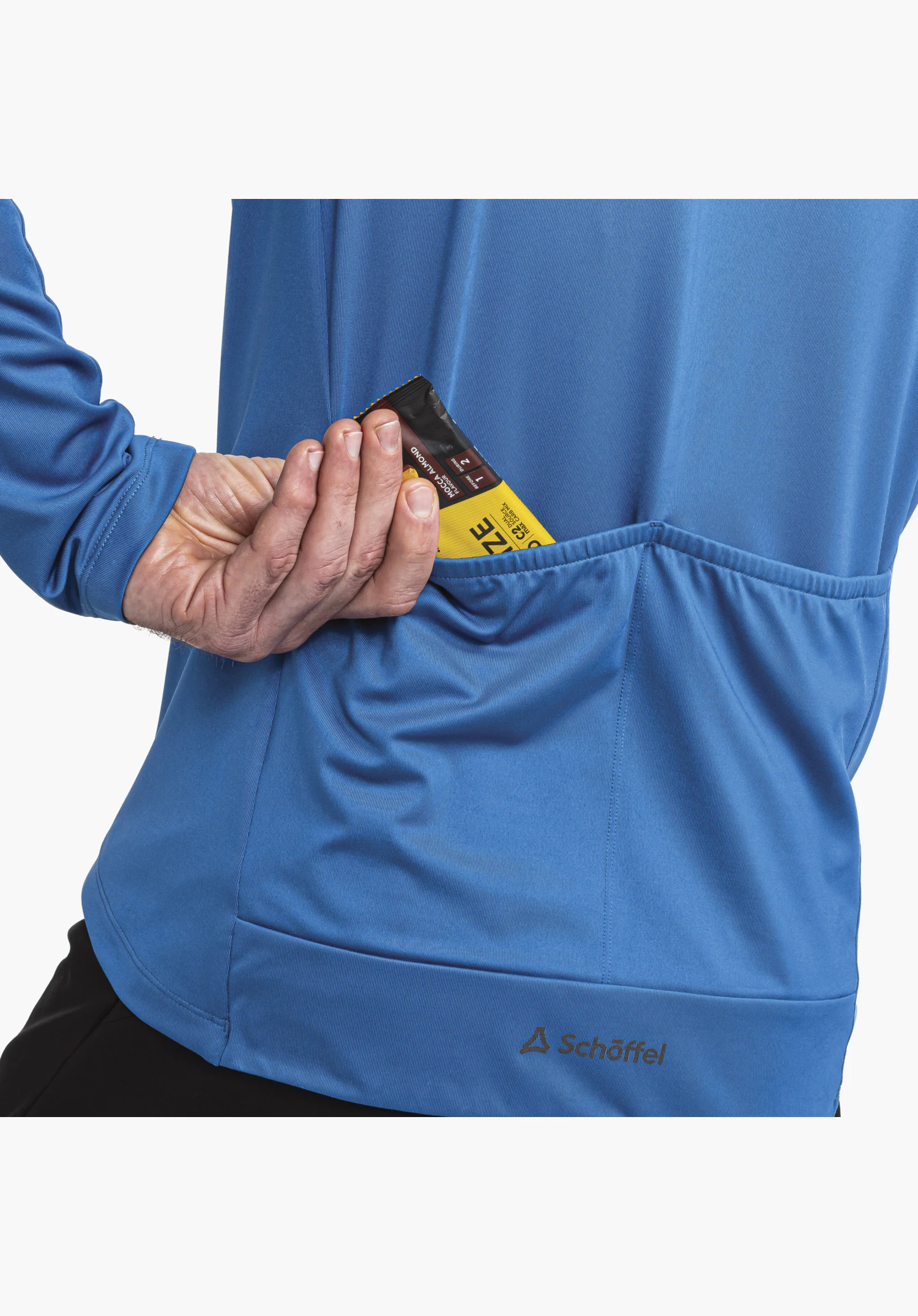 Longsleeve Style Kubena MNS displays the three-part back pocket on the blue fabric with a hand reaching for a bar, and the Schöffel logo at the hem as a close-up against a white/neutral background.