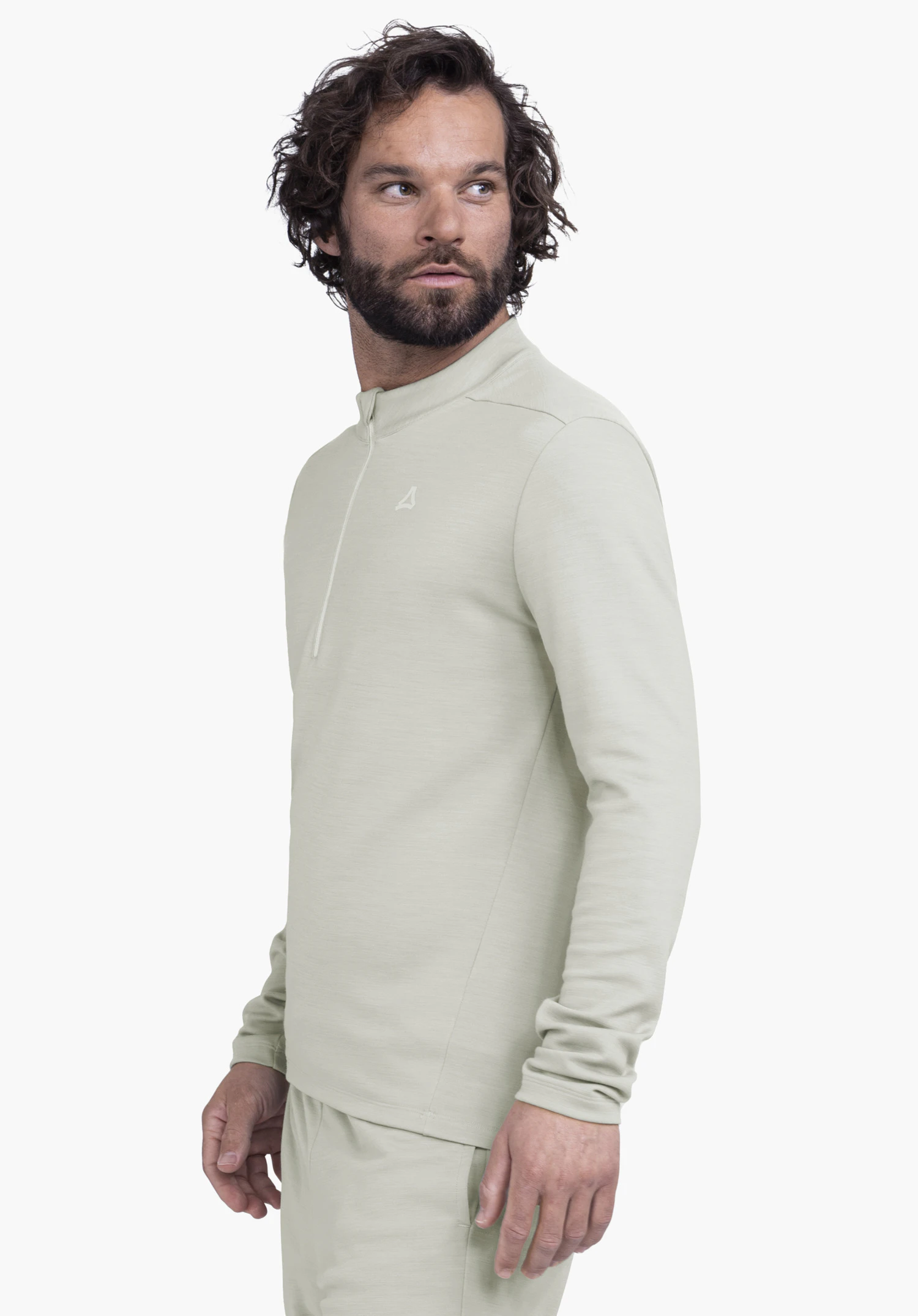 Longsleeve Style Canyfer MNS light green long-sleeve sports top with Schöffel logo, worn by a man looking to the side; relaxed pose in front of a light white background.