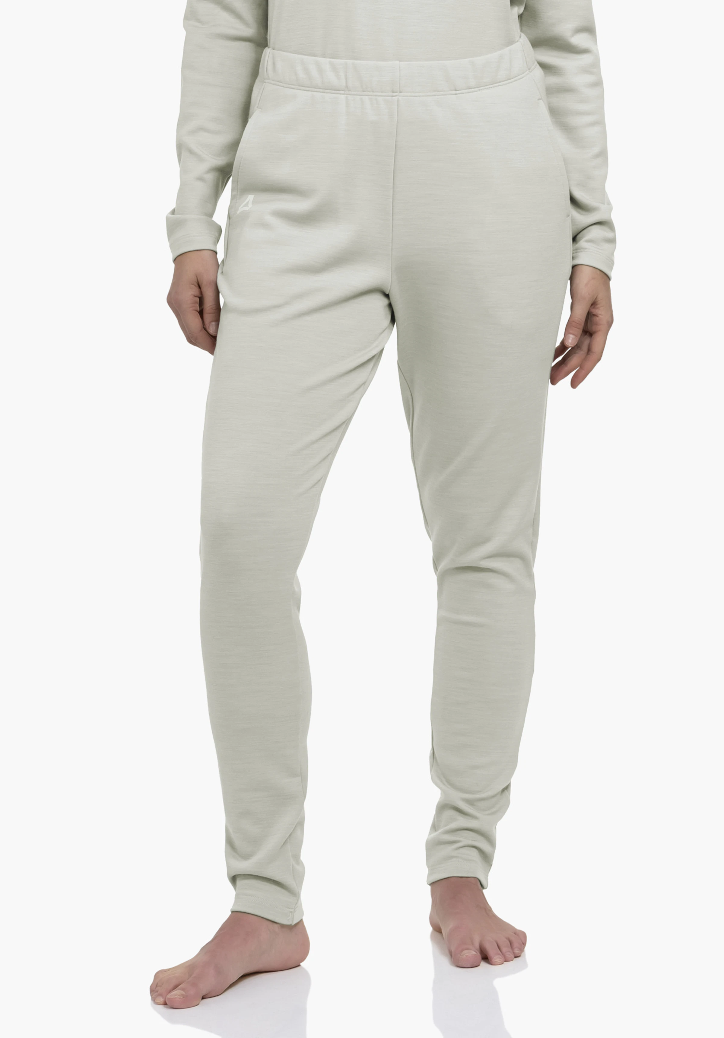 Pants Style Canyfer WMS Light green jogging trousers, worn, standing on a white background; legs slightly apart, barefoot, hands at sides; white Schöffel logo on left hip.