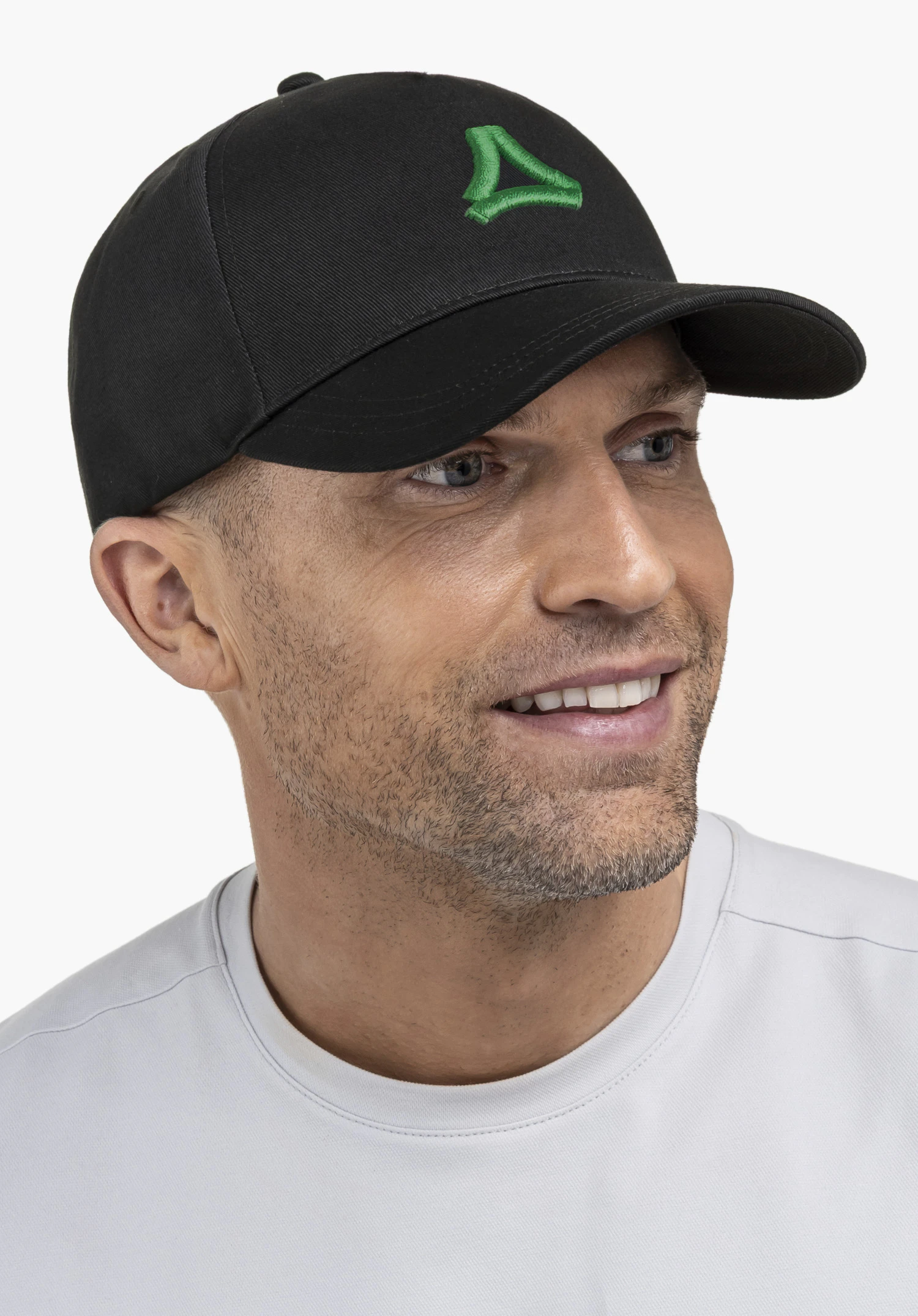 Cap Style Collada UNI in black, worn by a model in a side profile close-up featuring a visible green Schöffel logo against a neutral background.