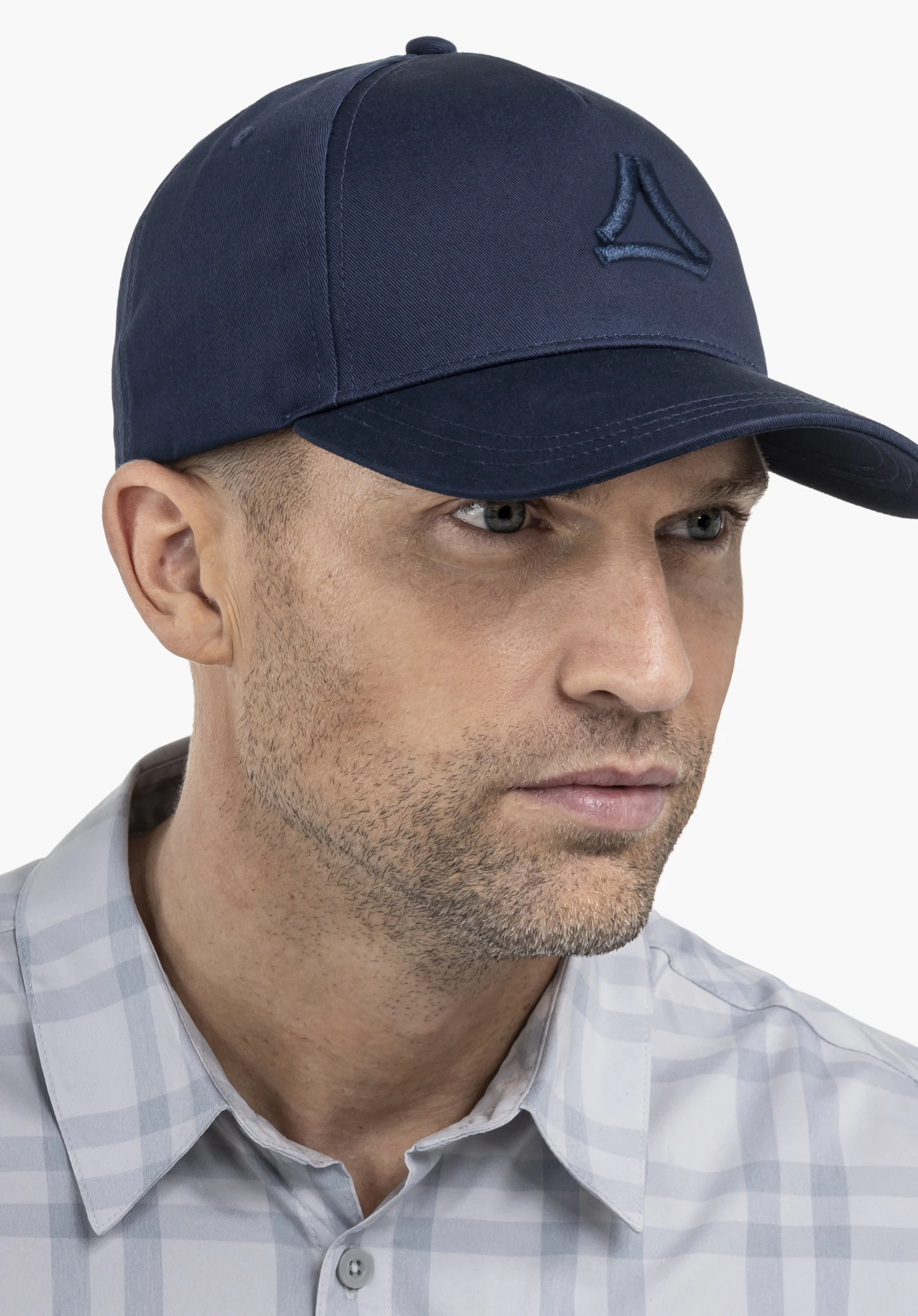 Cap Style Collada UNI, worn by a model in a side view against a neutral background; the Schöffel logo is featured in blue on the front.