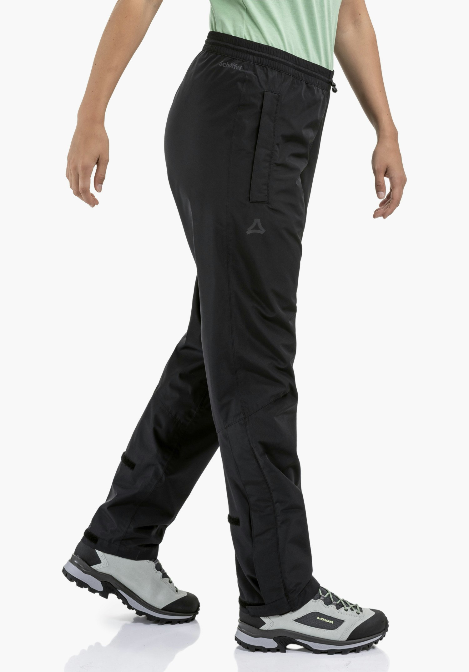 Rain Pants Style Elmori UNI montre la taille élastiquée, la poche latérale et le Schöffel-Logo sur le tissu noir, gros plan sur fond blanc/neutre.