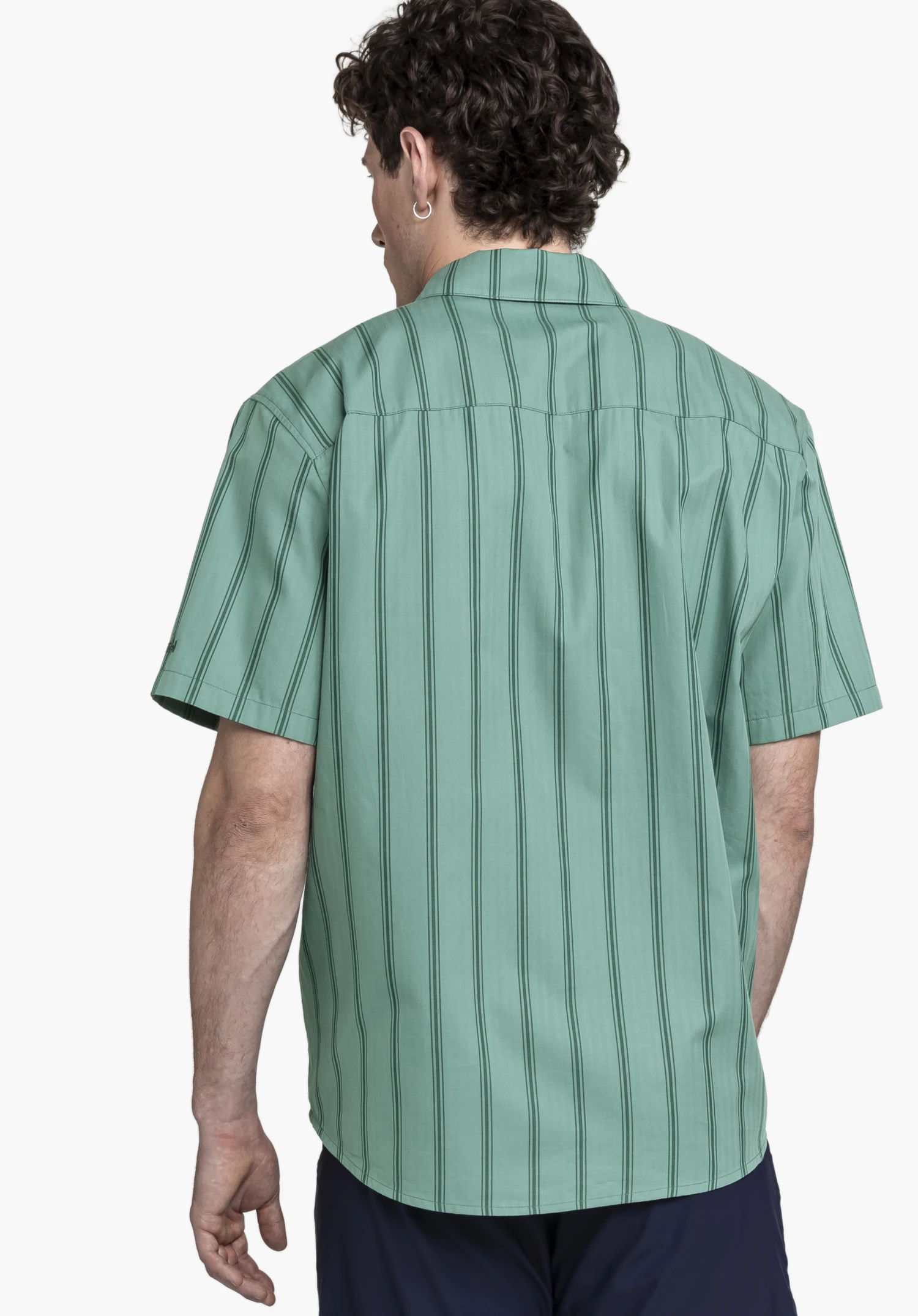 Shirt Style Kalmen MEN in green shown from the back view, worn by a model against a neutral background. The striped short-sleeved shirt features the subtle Schöffel logo on the sleeve.