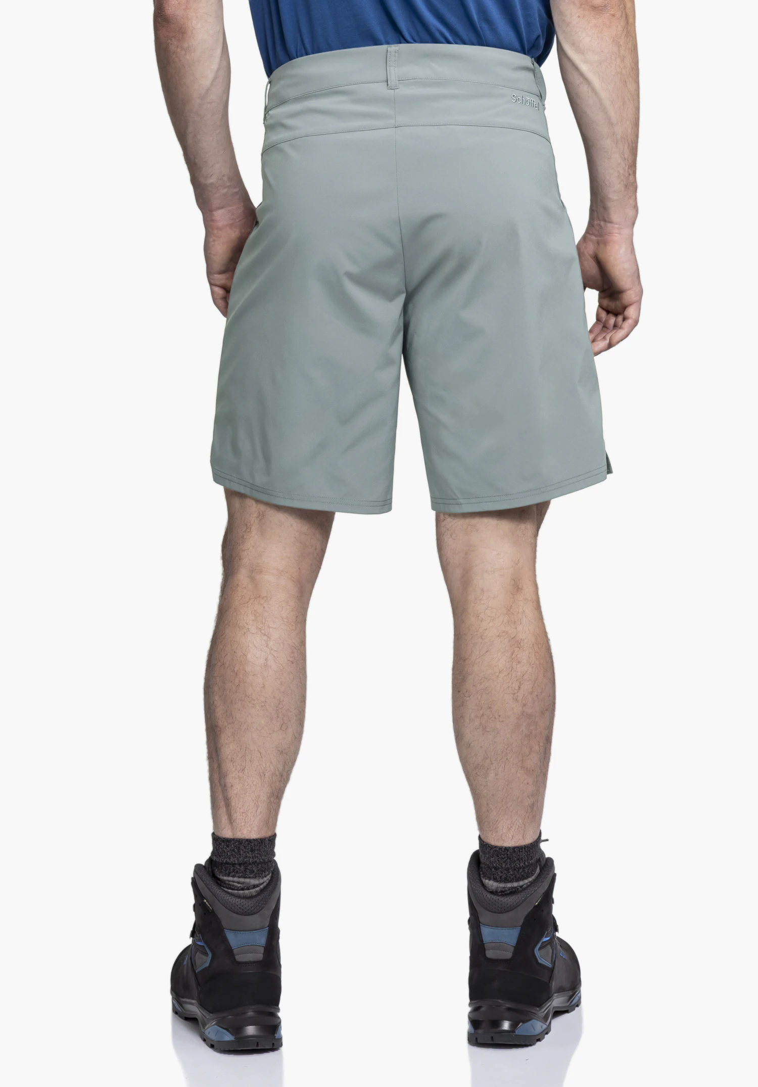 CIRC Shorts Style Smue MEN in grey, worn by a model shown from a back view. The Schöffel logo is visible on the back right below the waistband. The man stands upright in front of a neutral background.