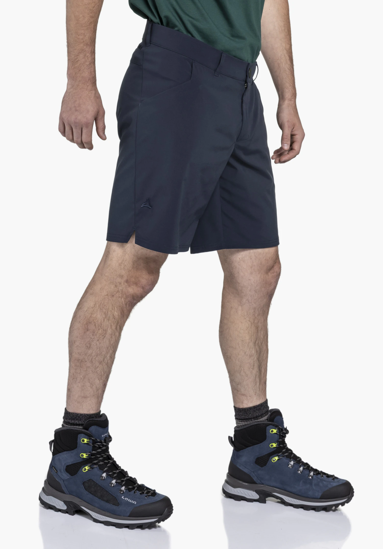CIRC Shorts Style Smue MEN: A model wearing the blue shorts, captured from a side profile against a neutral background. The subtle, tonal Schöffel logo on the leg completes the functional design, perfect for active days outdoors.