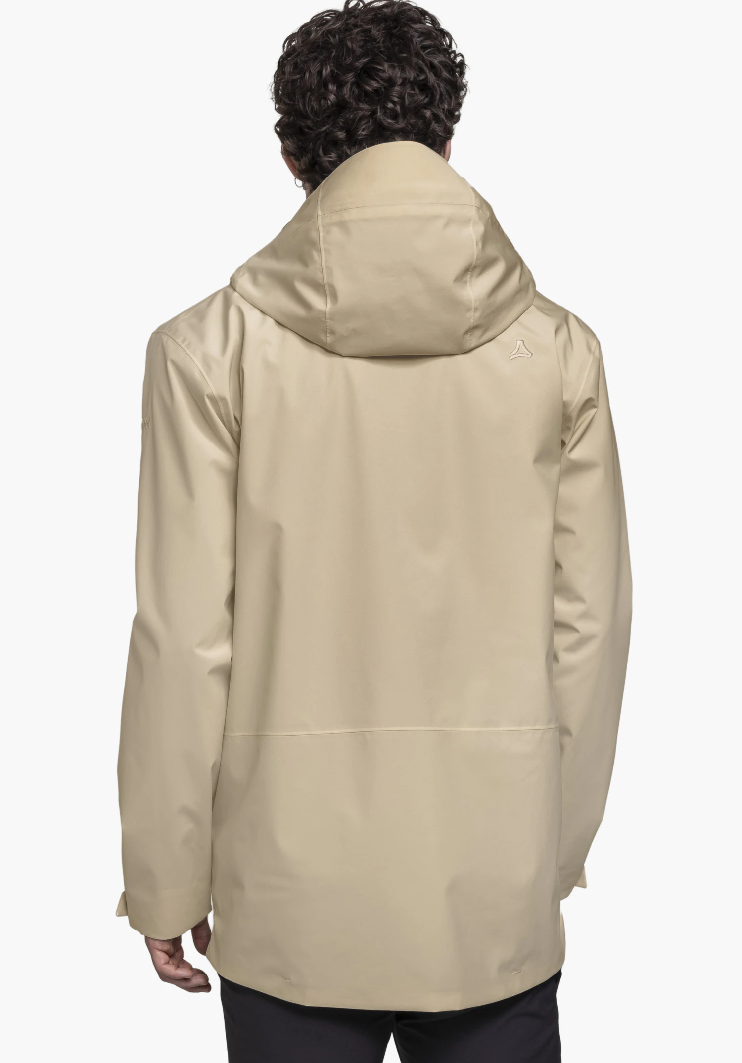 CIRC Jacket Style Smue MEN in beige worn by a model in a back view. The Schöffel-Logo is visible on the right shoulder, photographed against a neutral background.
