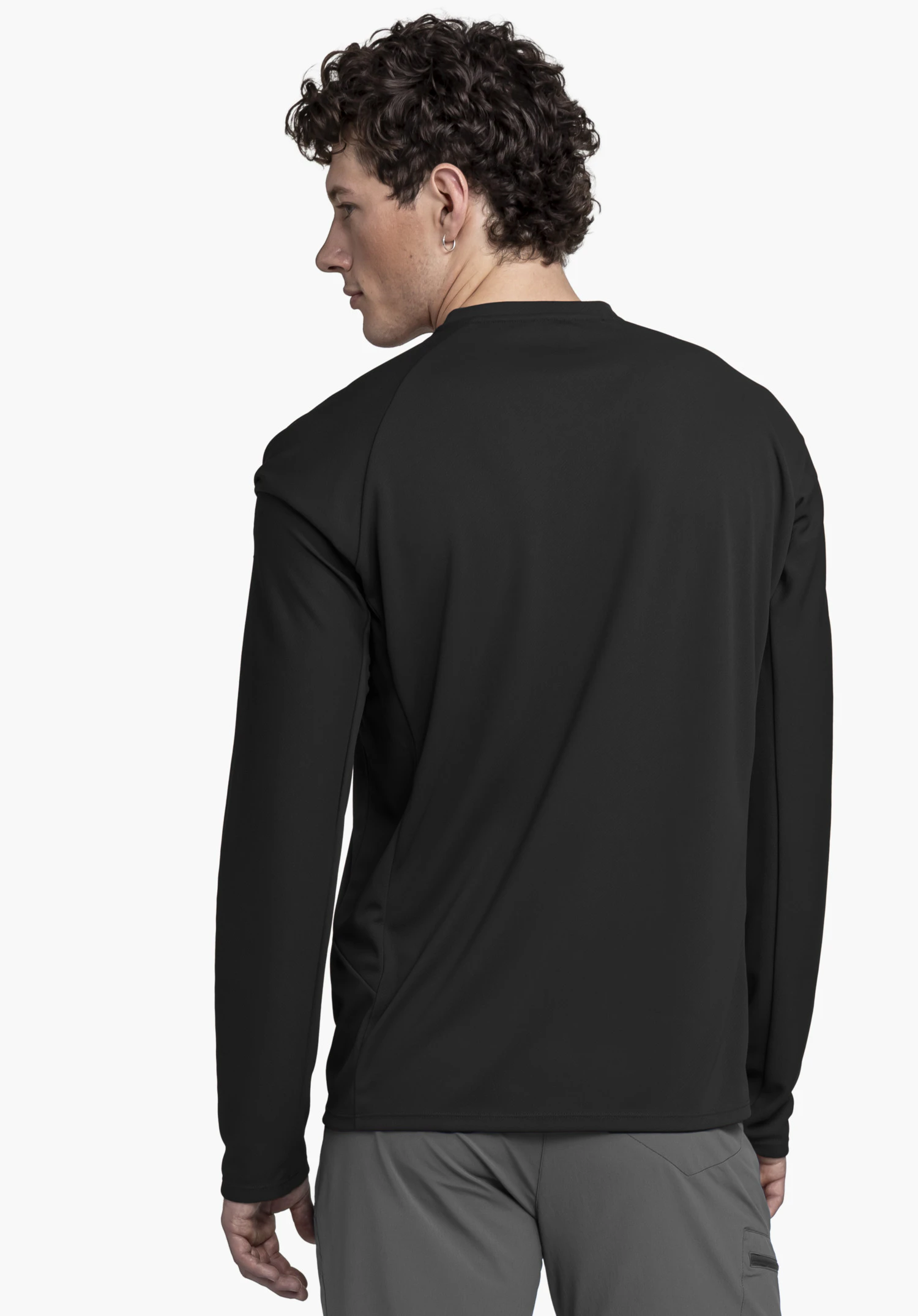 Longsleeve Style Enixa MEN in black: The model is seen from the back against a neutral background, highlighting the fit of the performance shirt.