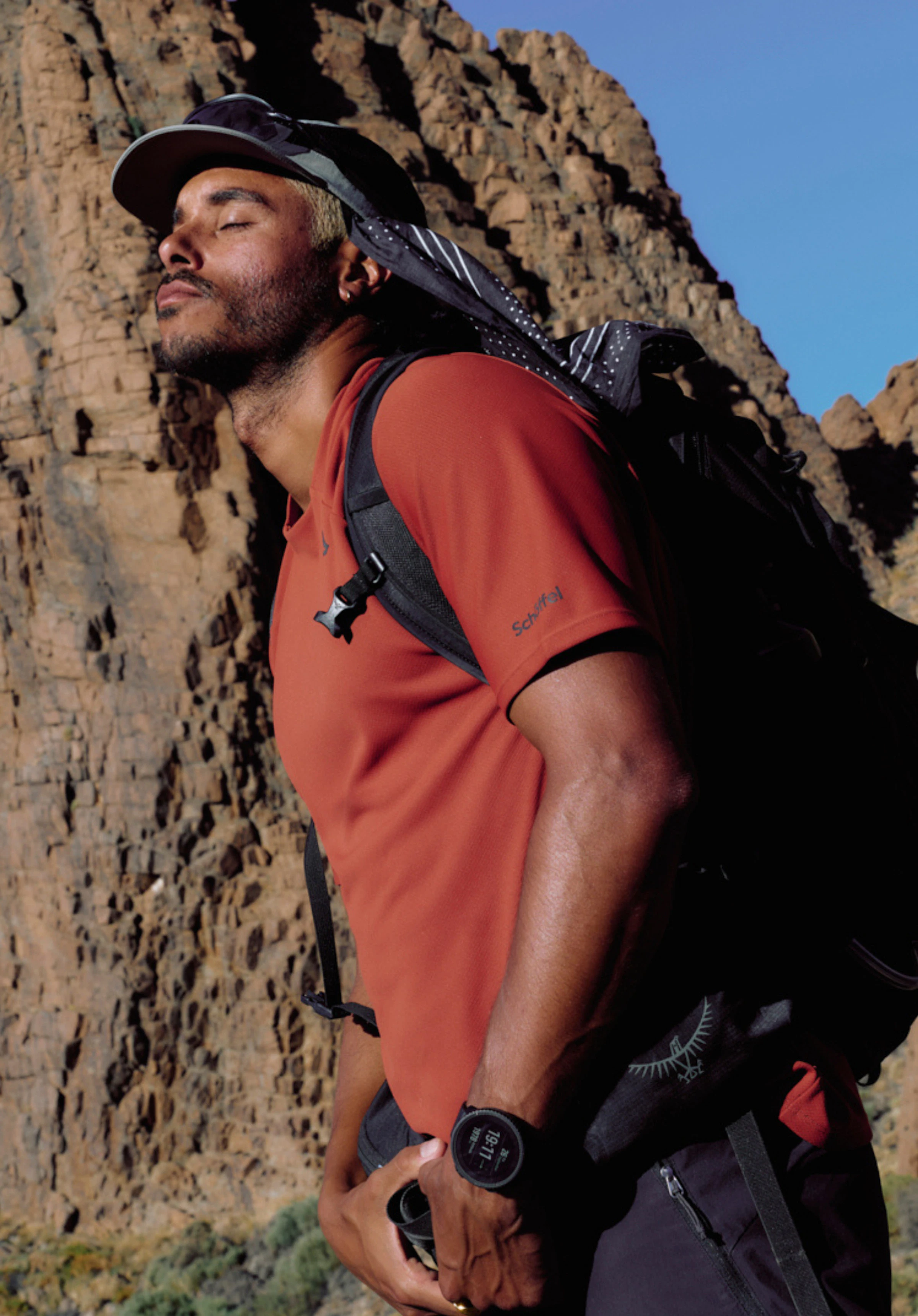 T Shirt Style Enixa MEN: The model stands frontally against a neutral background wearing the shirt in a bold red colour. The subtle Schöffel logo is clearly visible on the chest.