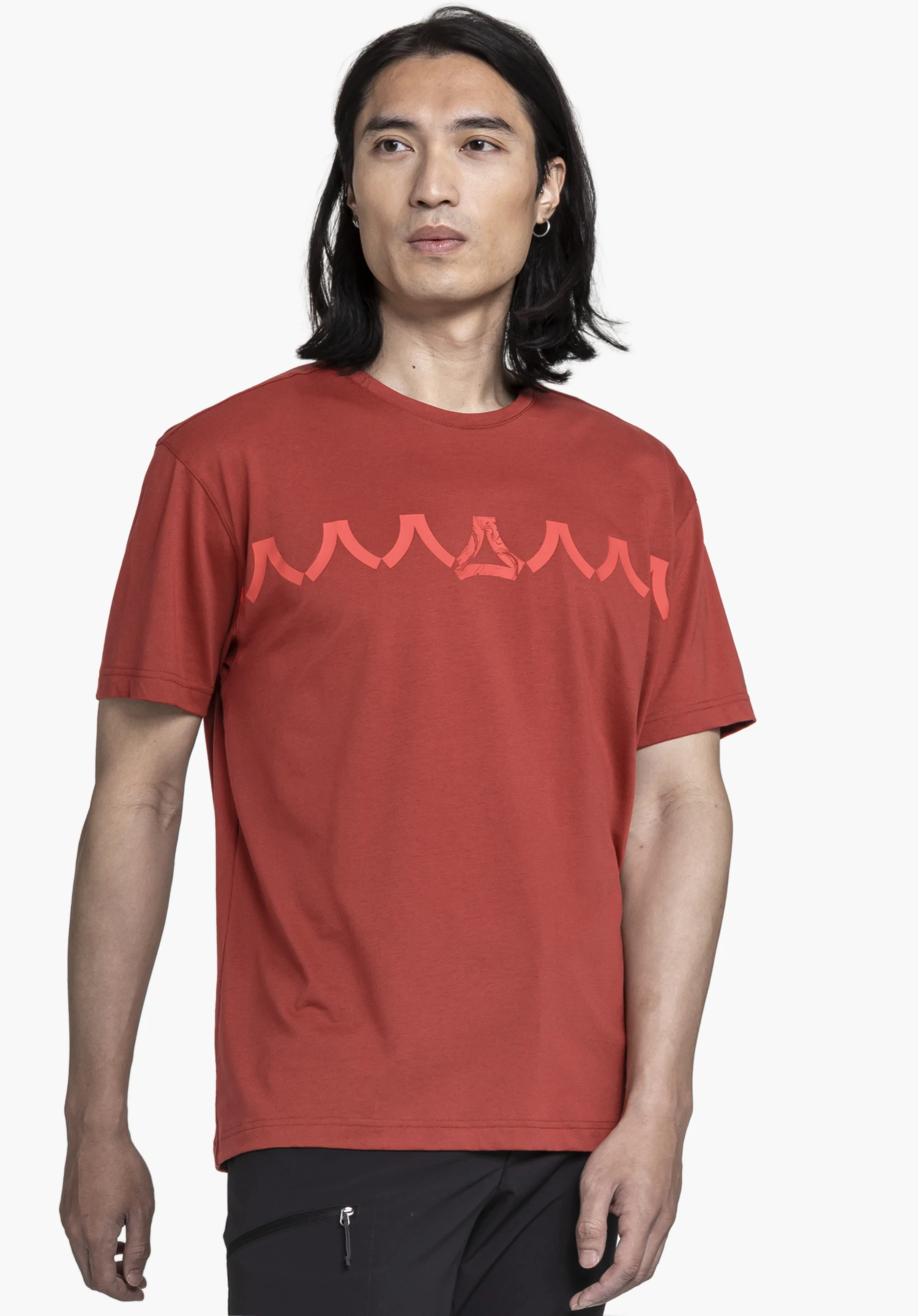T Shirt Style Elmori MEN in red, shown in a frontal view. A model wears the shirt against a neutral background, highlighting the distinctive graphic print and the Schöffel logo on the chest.
