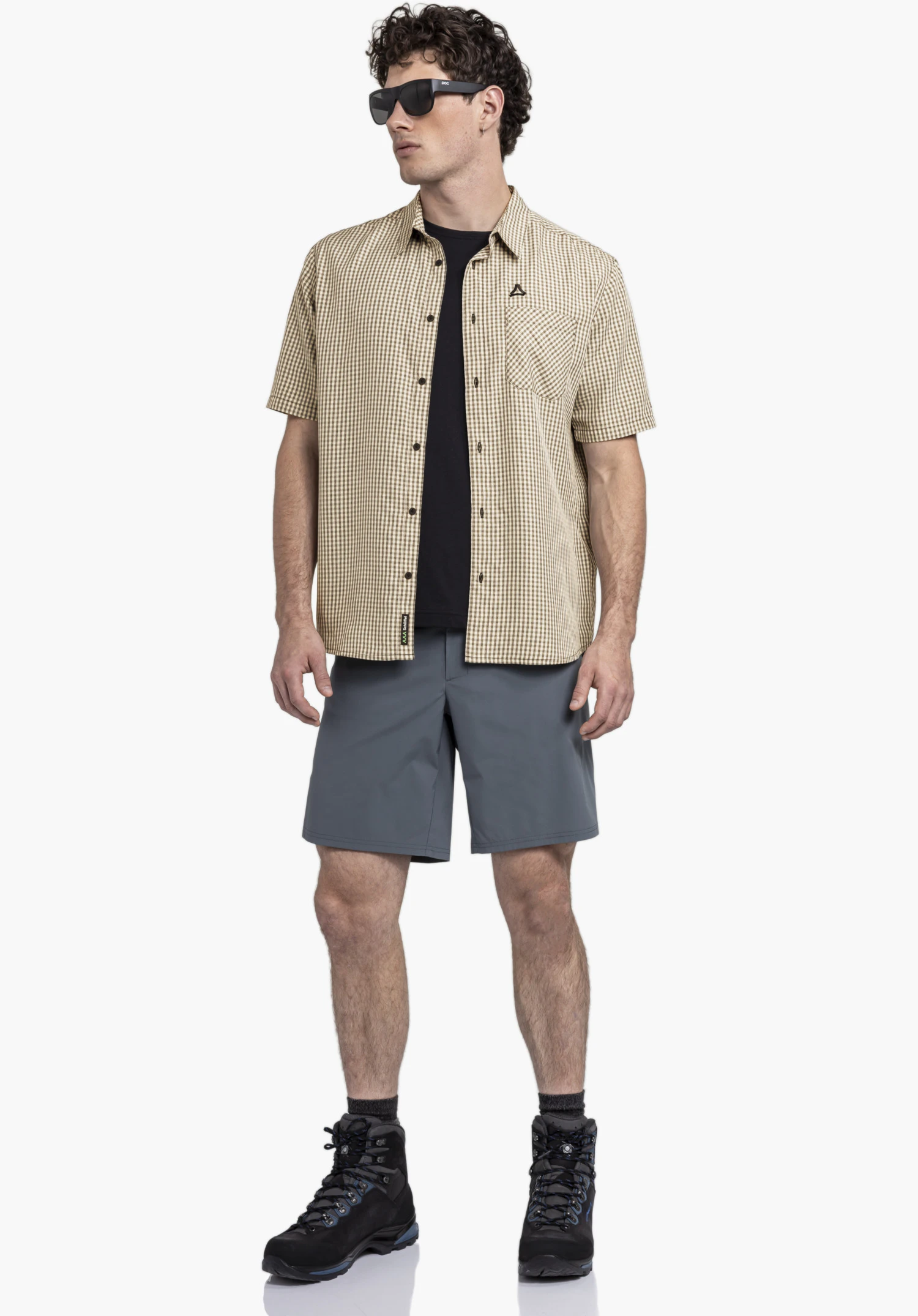 CIRC Shirt Style Dalfoss MEN shows the black Schöffel logo on the chest pocket and the black buttons on the chequered fabric. Close-up in front of a white/neutral background.