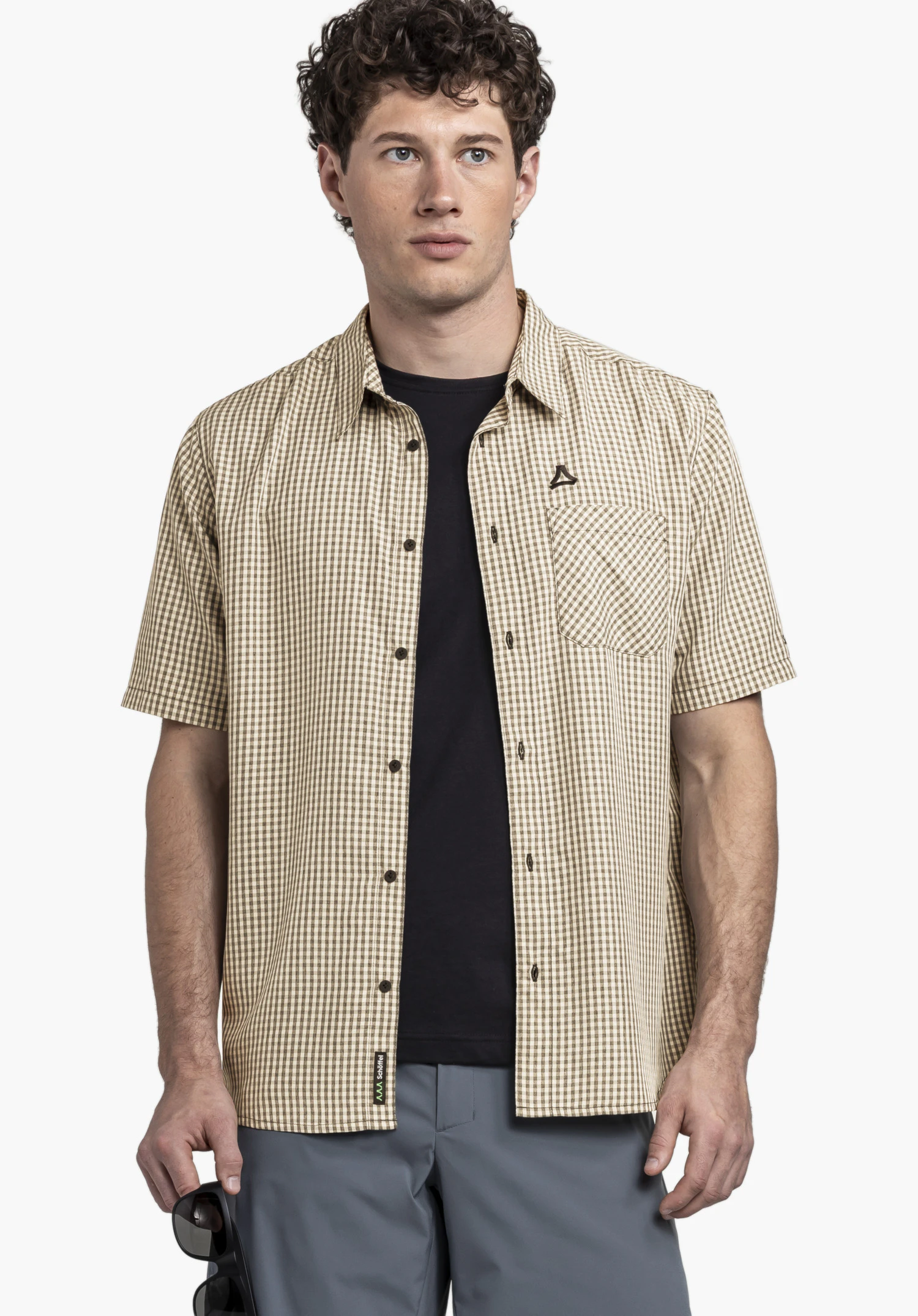 CIRC Shirt Style Dalfoss MEN, detail of the chest pocket and the black Schöffel logo on the chequered fabric, close-up against a white/neutral background.