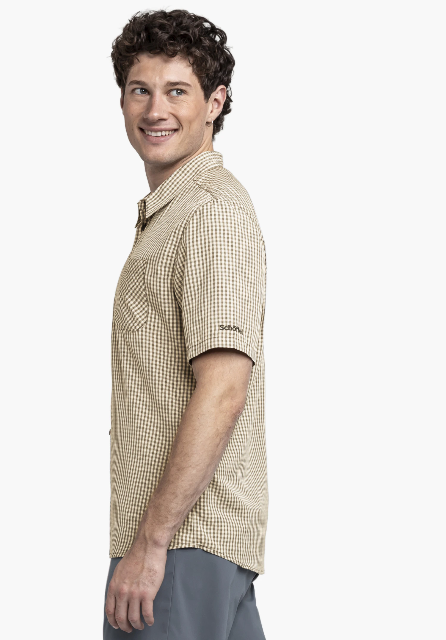 CIRC Shirt Style Dalfoss MEN. A model stands sideways against a neutral background, wearing the short-sleeved shirt in black. The Schöffel logo is visible on the left sleeve.