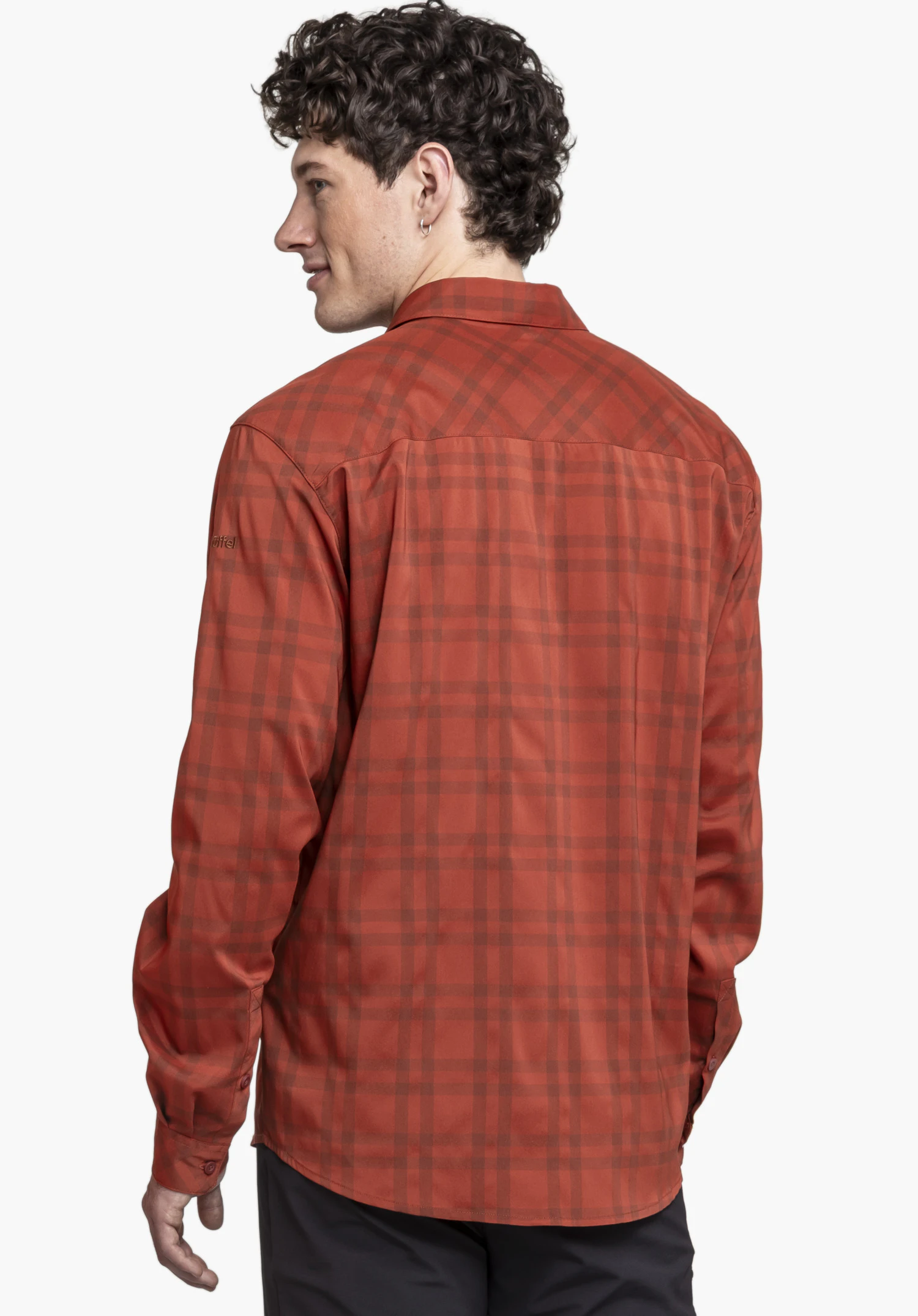 Shirt Style Fraris MEN in red shown in a side-back view. The model stands against a neutral background and wears the shirt, highlighting the subtle Schöffel logo on the sleeve.