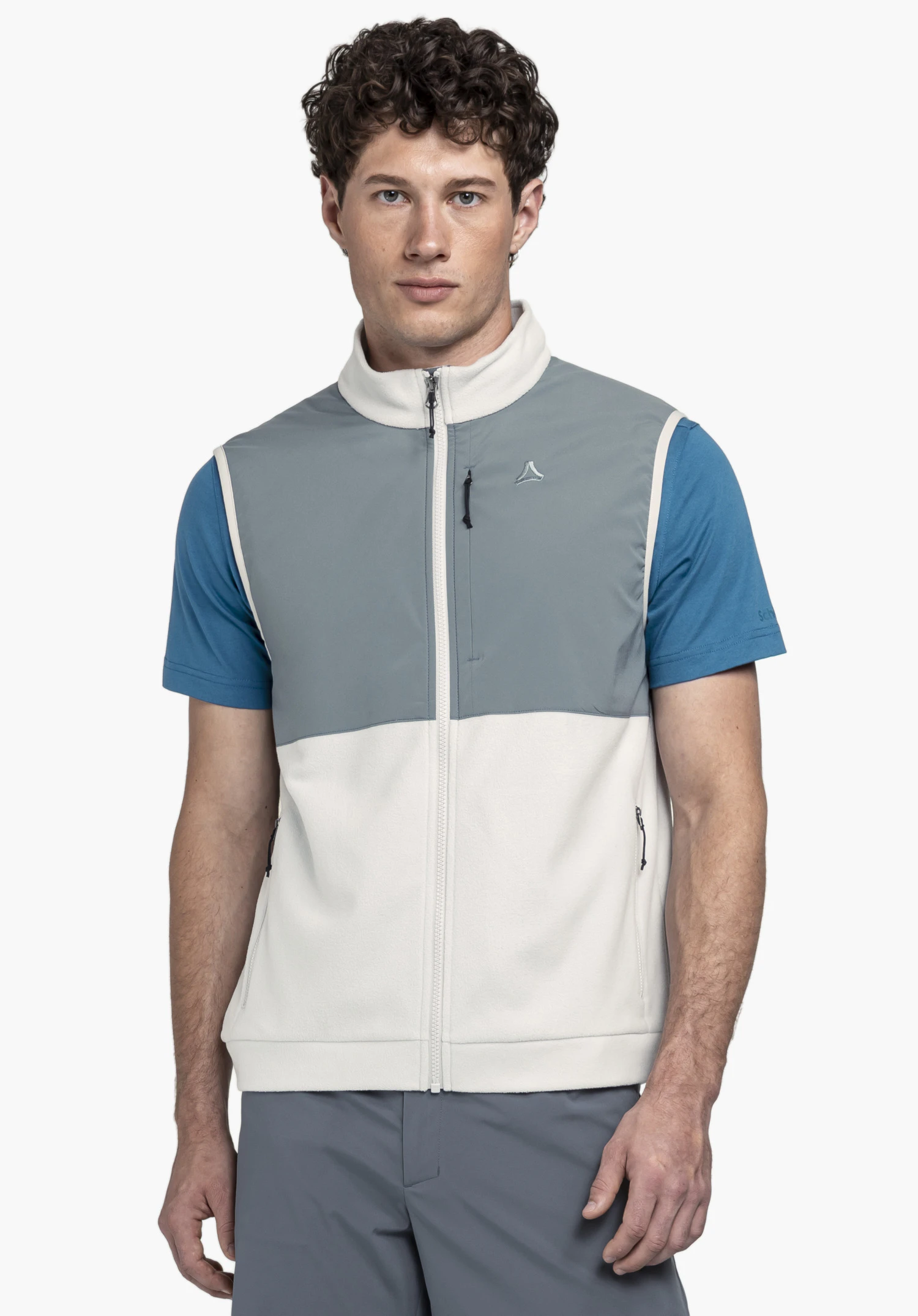 Fleece Vt Style Ash MEN worn by a model standing frontally. The gilet is presented in grey and features the Schöffel-Logo on the left chest. The model is photographed against a neutral background.