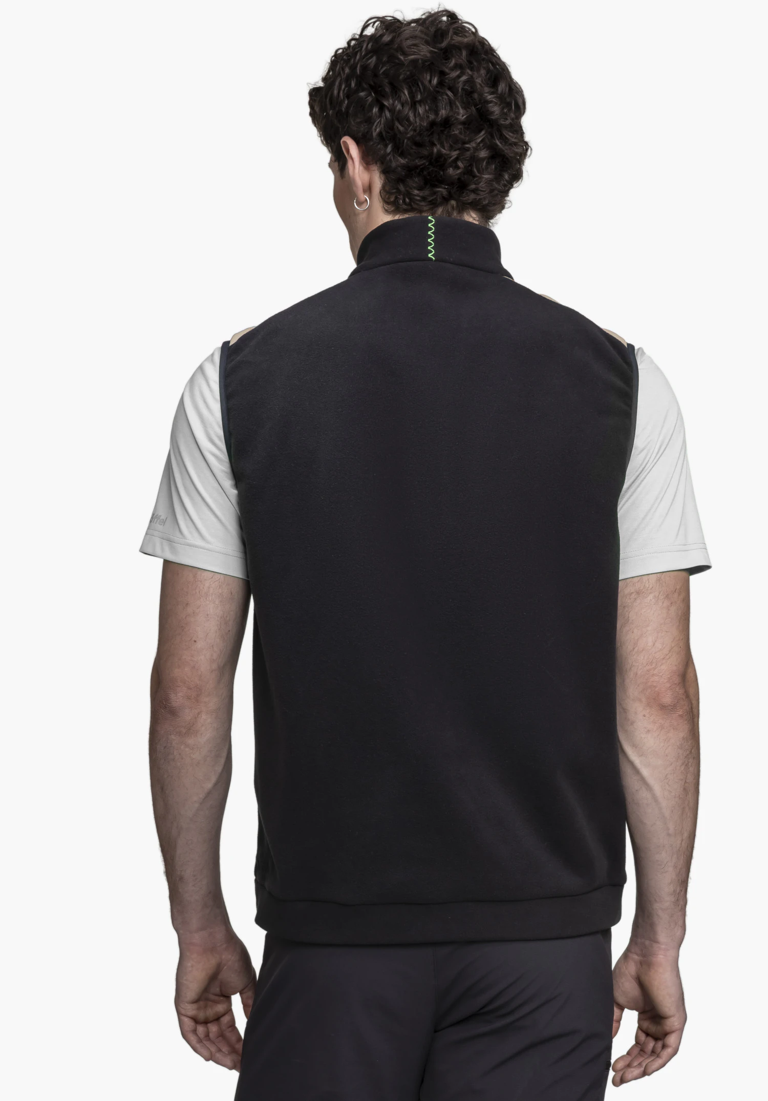 Fleece Vt Style Ash MEN in a back view against a neutral background. The model is wearing the gilet in black over a light-coloured t-shirt, with the Schöffel logo visible on the t-shirt sleeve.