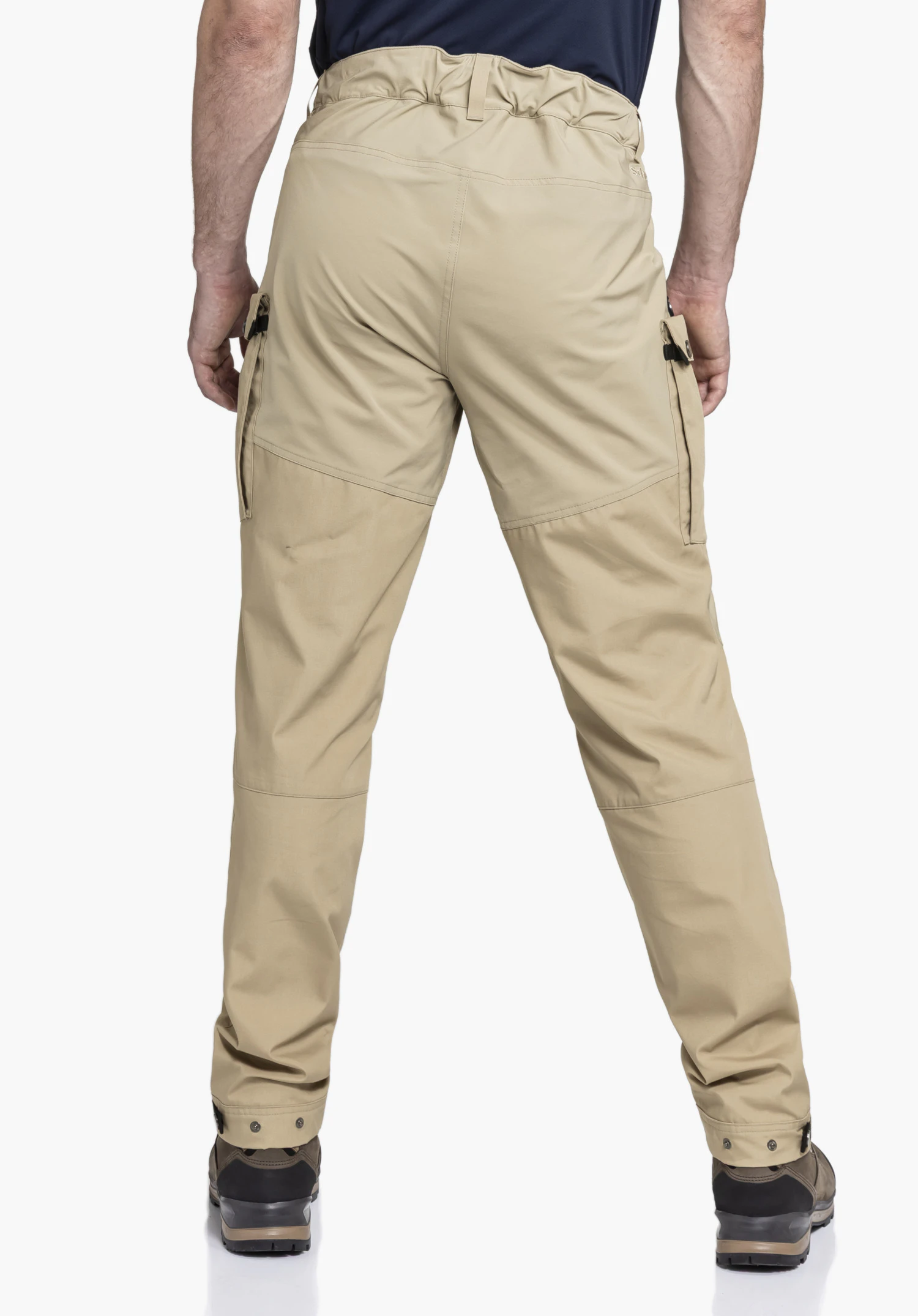 Pants Style Maghera MEN in beige in a rear view against a neutral background, showing the Schöffel logo on the waistband and functional leg pockets.