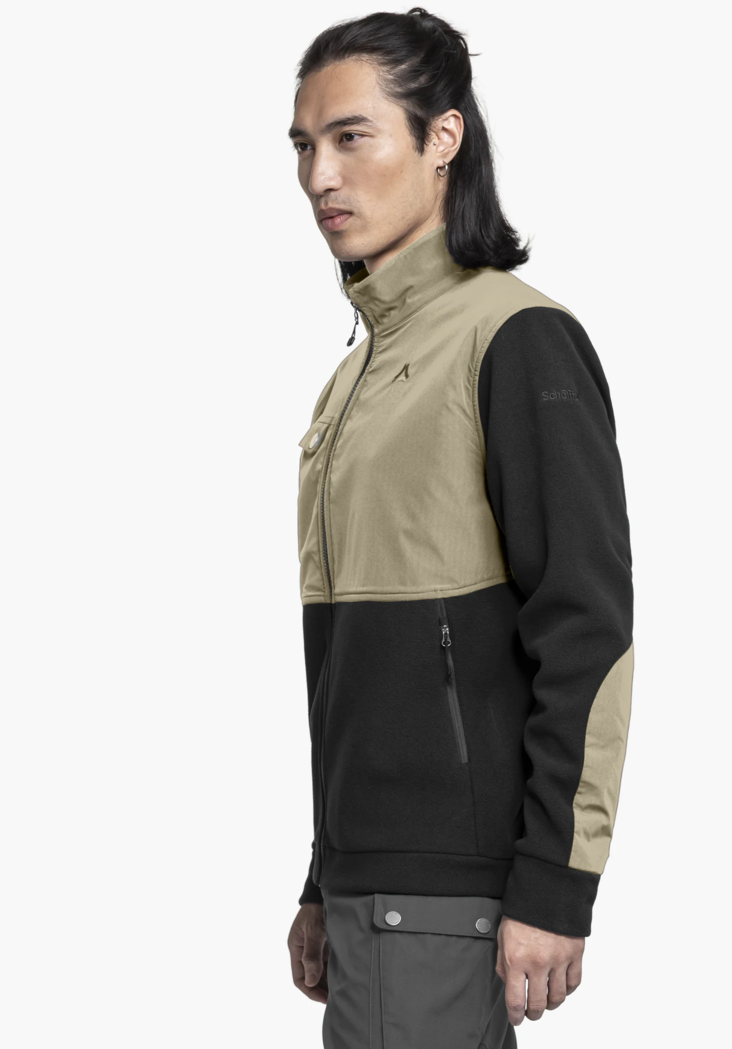 Fleece Jk Style Maghera MEN shown on a model from a side profile against a neutral background. The black jacket features functional panels and a subtle Schöffel logo on the upper arm.