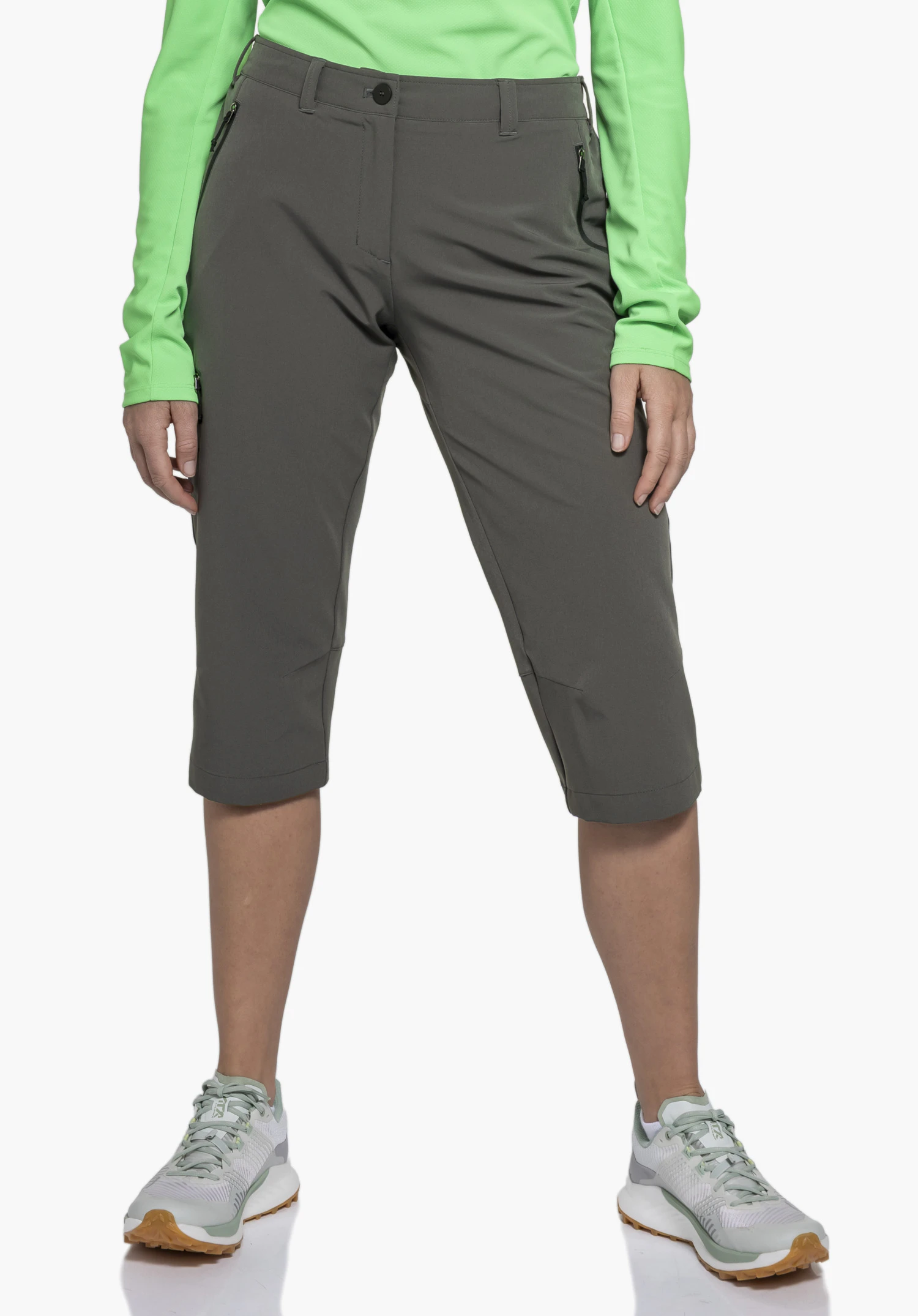 Pants Style Chavuma WMN worn by a model standing facing forward. The 3/4-length trousers in grey feature visible zip pockets and are presented against a neutral background.