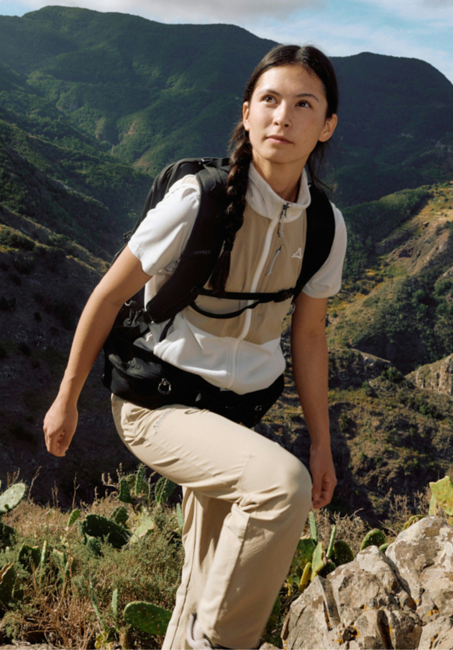 Fleece Vt Style Ash WMN worn by a model standing frontally with both hands resting in the side pockets. The vest in the colour natur features a colour-block design and shows the Schöffel logo on the left chest, photographed against a neutral background.